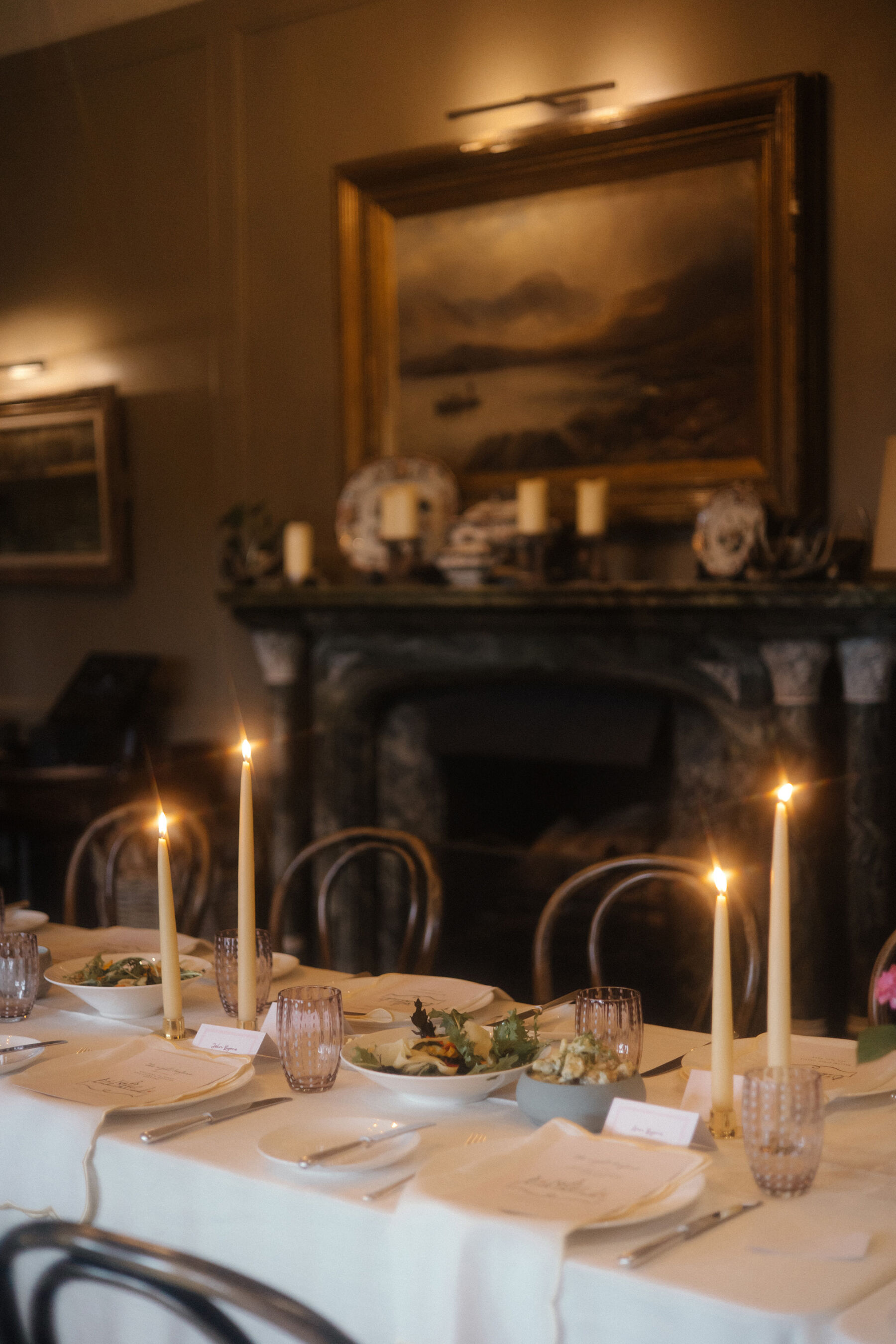 Romantic Ballynahinch Castle Wedding: Ciara in Danielle Frankel 10 Elegant taper candles on while linen tables with low fasting bowls.