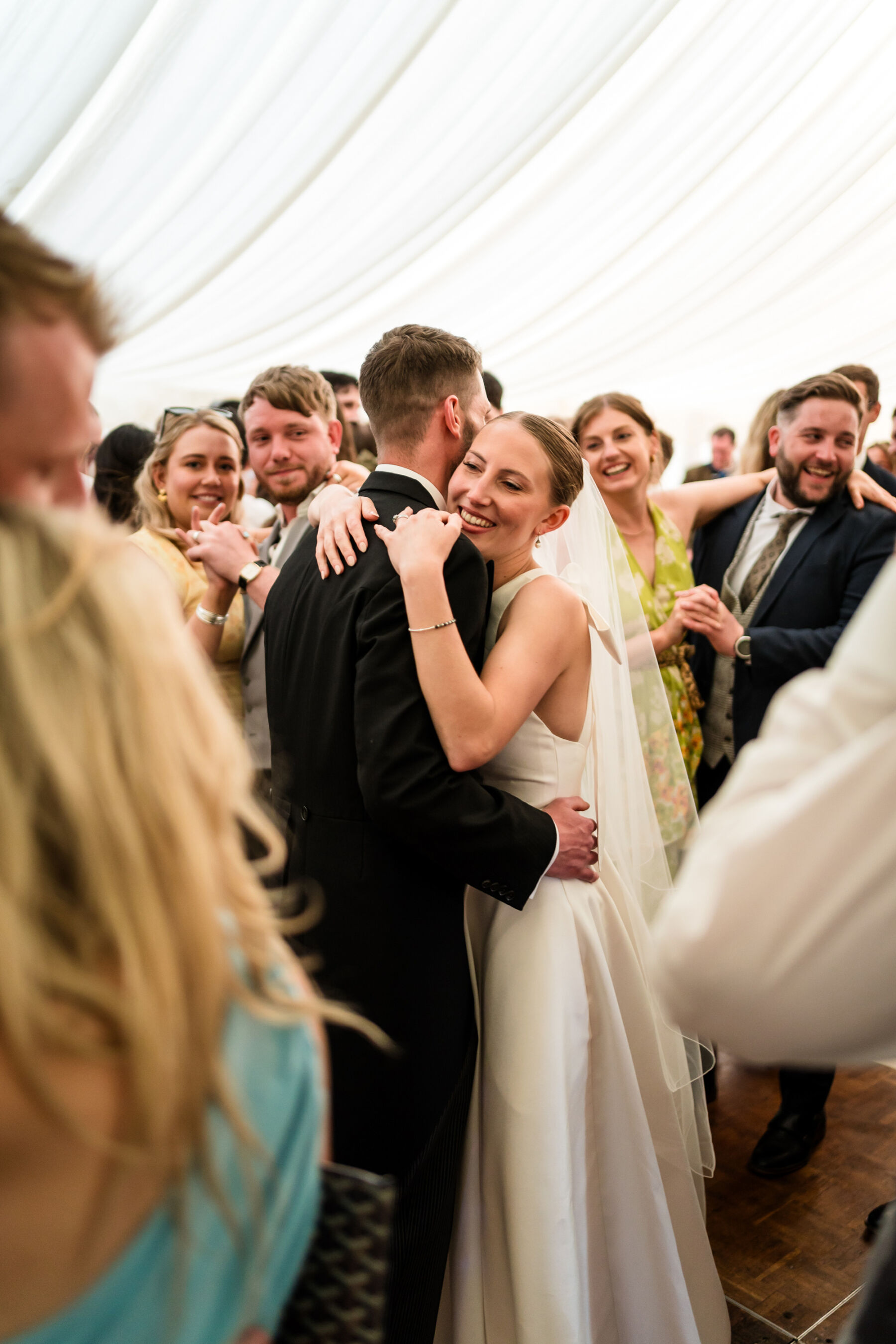Alice Wore Oak by Halfpenny London For Her Charming Spring Marquee Wedding in Suffolk 36 Bride and groom dancing inside their wedding marquee.