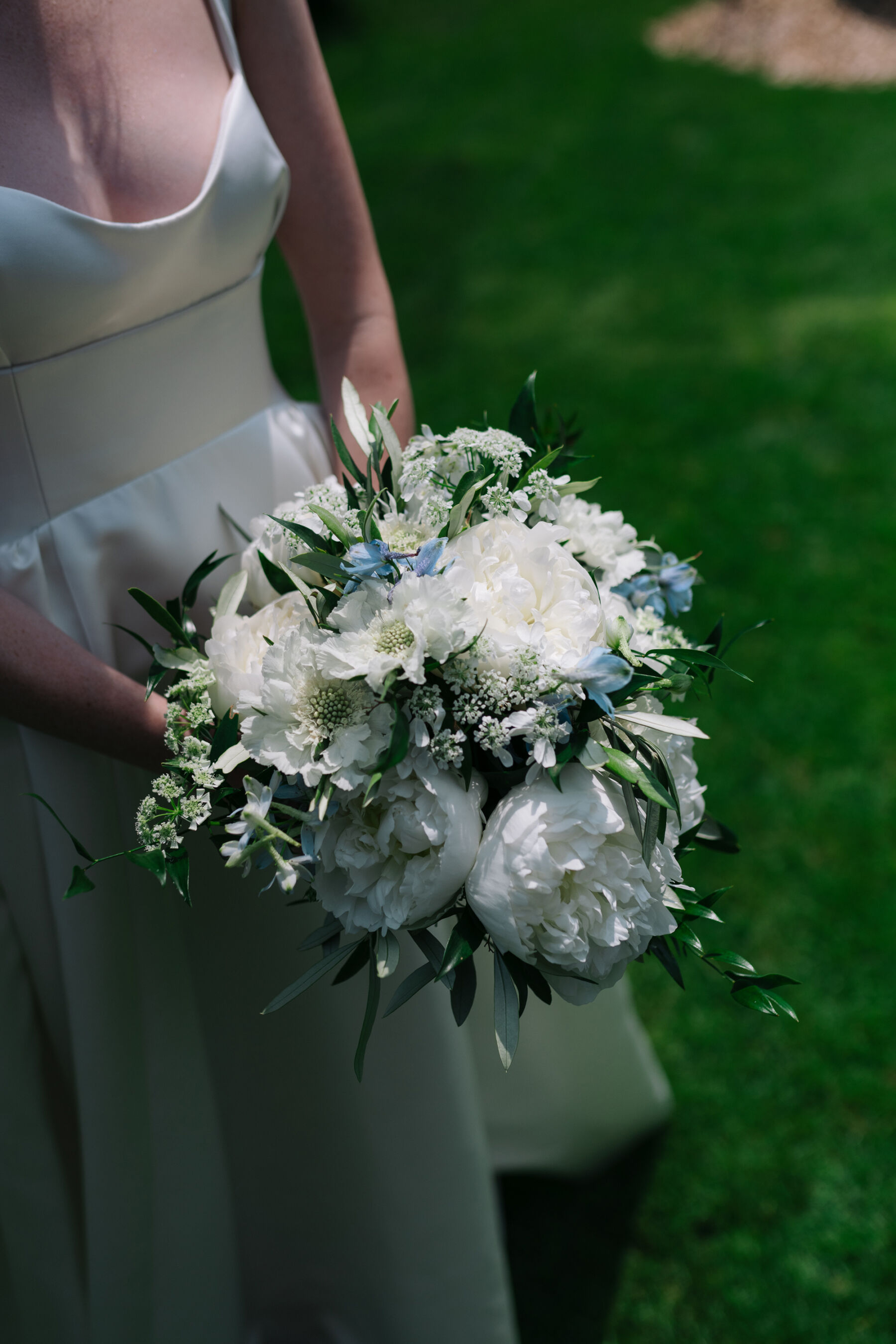 Georgia in Emilia Wickstead, For Her Classy & Elegant Black Tie Mountain Wedding in the Chamonix 16 White wedding bouquet with little blue flowers.