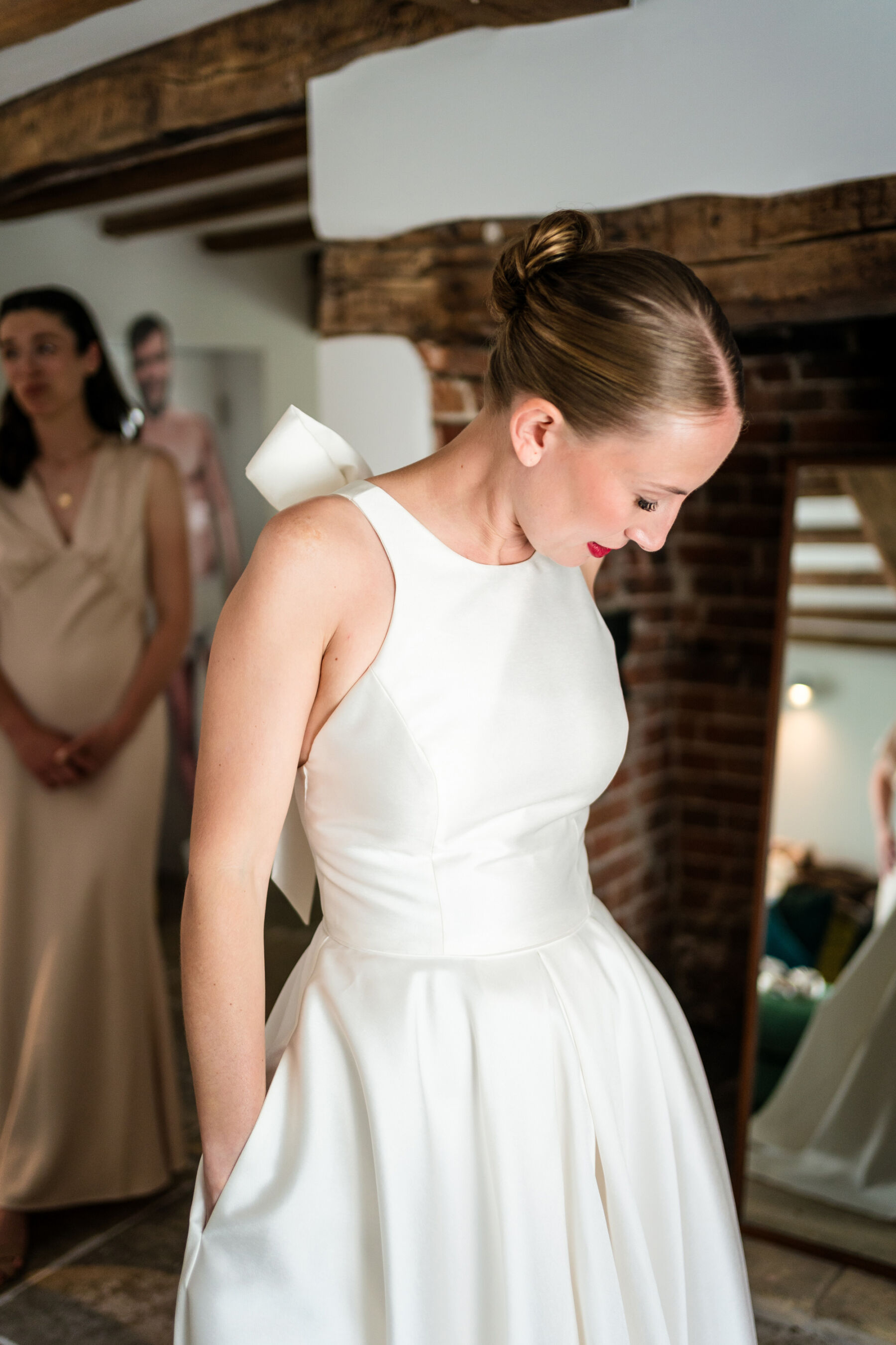 Alice Wore Oak by Halfpenny London For Her Charming Spring Marquee Wedding in Suffolk 16 Bride getting ready in her Oak by Halfpenny London wedding dress with pockets.