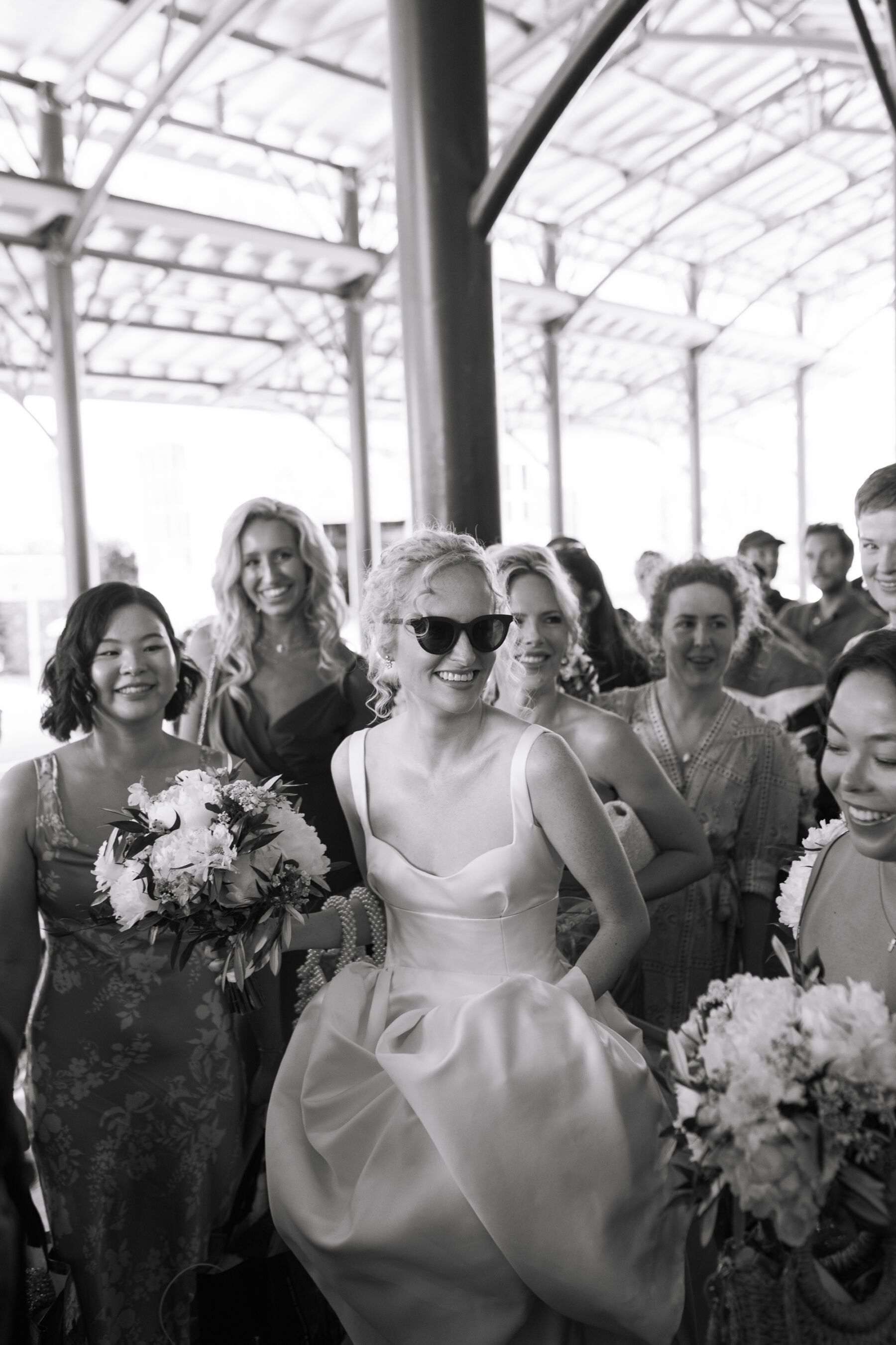 Georgia in Emilia Wickstead, For Her Classy & Elegant Black Tie Mountain Wedding in the Chamonix 18 Bride wears sunglasses and an Emilia Wickstead wedding dress.
