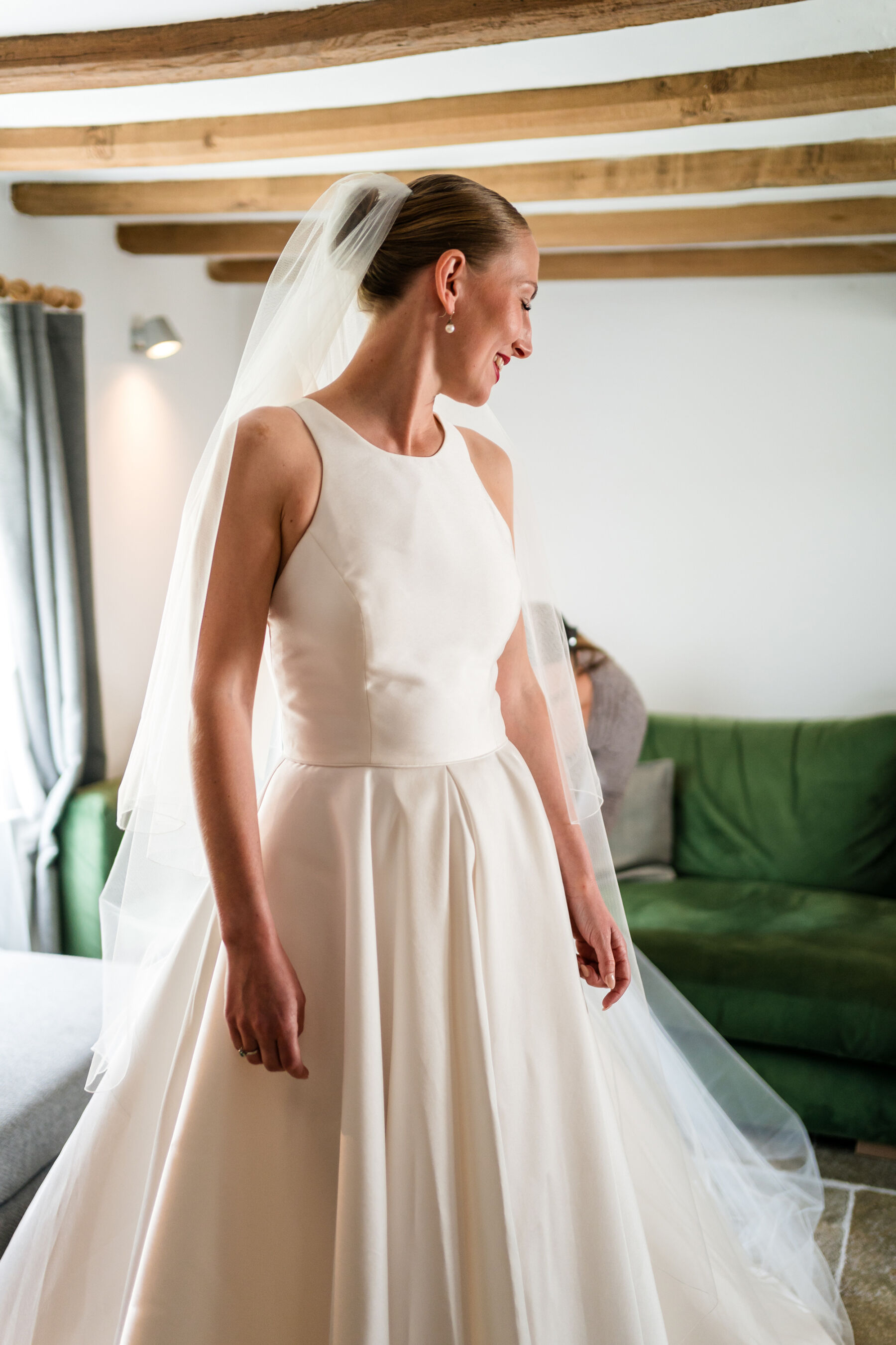 Alice Wore Oak by Halfpenny London For Her Charming Spring Marquee Wedding in Suffolk 13 Bride getting ready in her Oak by Halfpenny London wedding dress.