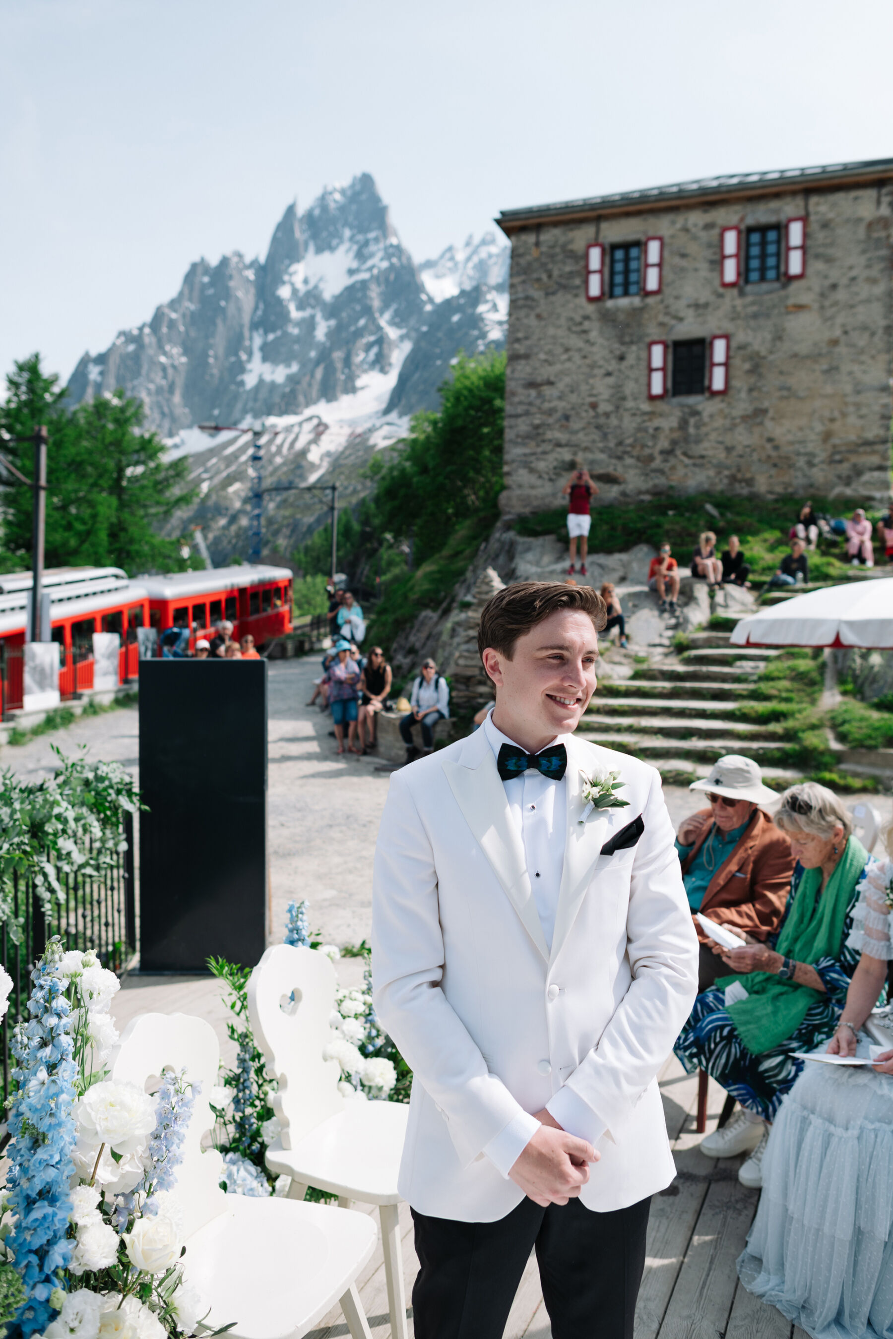 Georgia in Emilia Wickstead, For Her Classy & Elegant Black Tie Mountain Wedding in the Chamonix 21 Groom in a white tuxedo. Wedding at Mont Blanc, Chamonix.