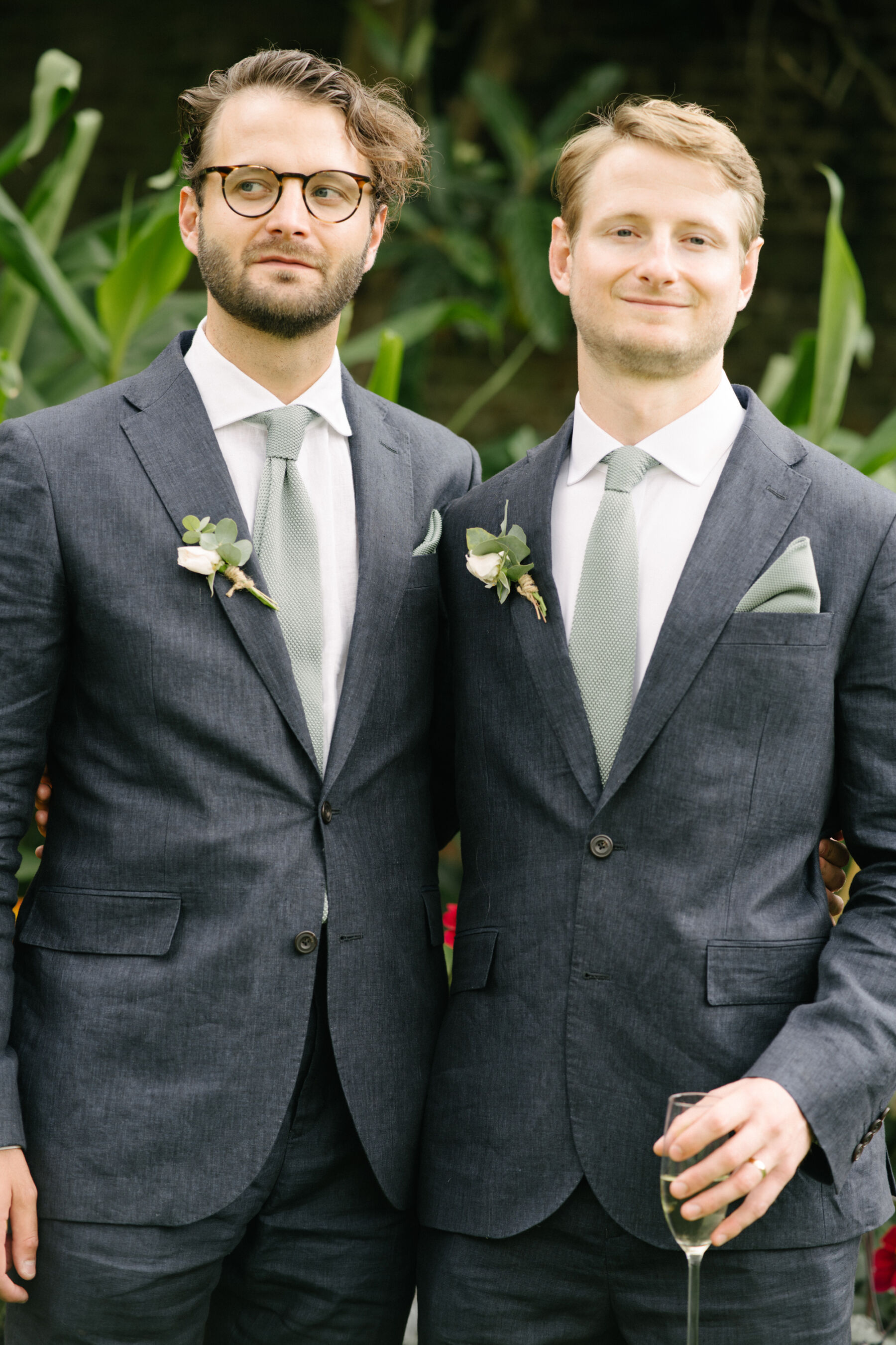 Relaxed, Romantic & Organic: Elena and Oliver's Cambridge Cottage Wedding at Kew Gardens 21 Groom and his best man, wearing dark blue linen suits from John Lewis.