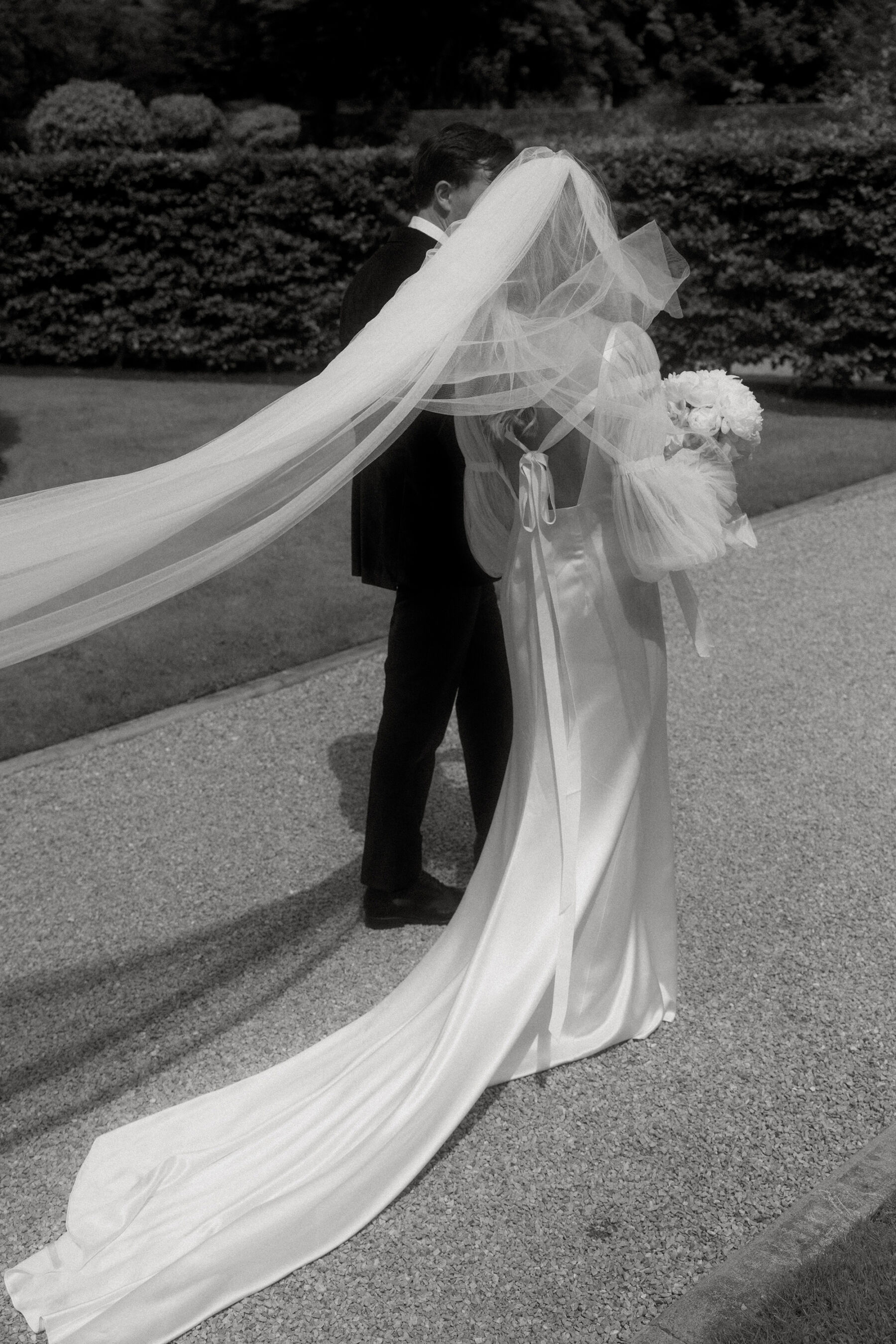 Romantic Ballynahinch Castle Wedding: Ciara in Danielle Frankel 28 Bride wearing a dress and long veil by Danielle Frankel.
