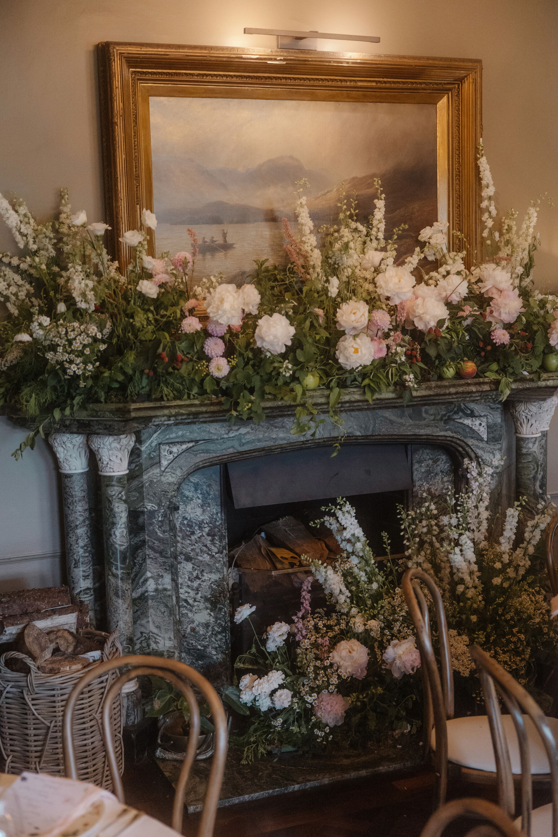 Romantic Ballynahinch Castle Wedding: Ciara in Danielle Frankel 31 Floral fireplace decorated for a wedding. Romantic and blousy flowers.