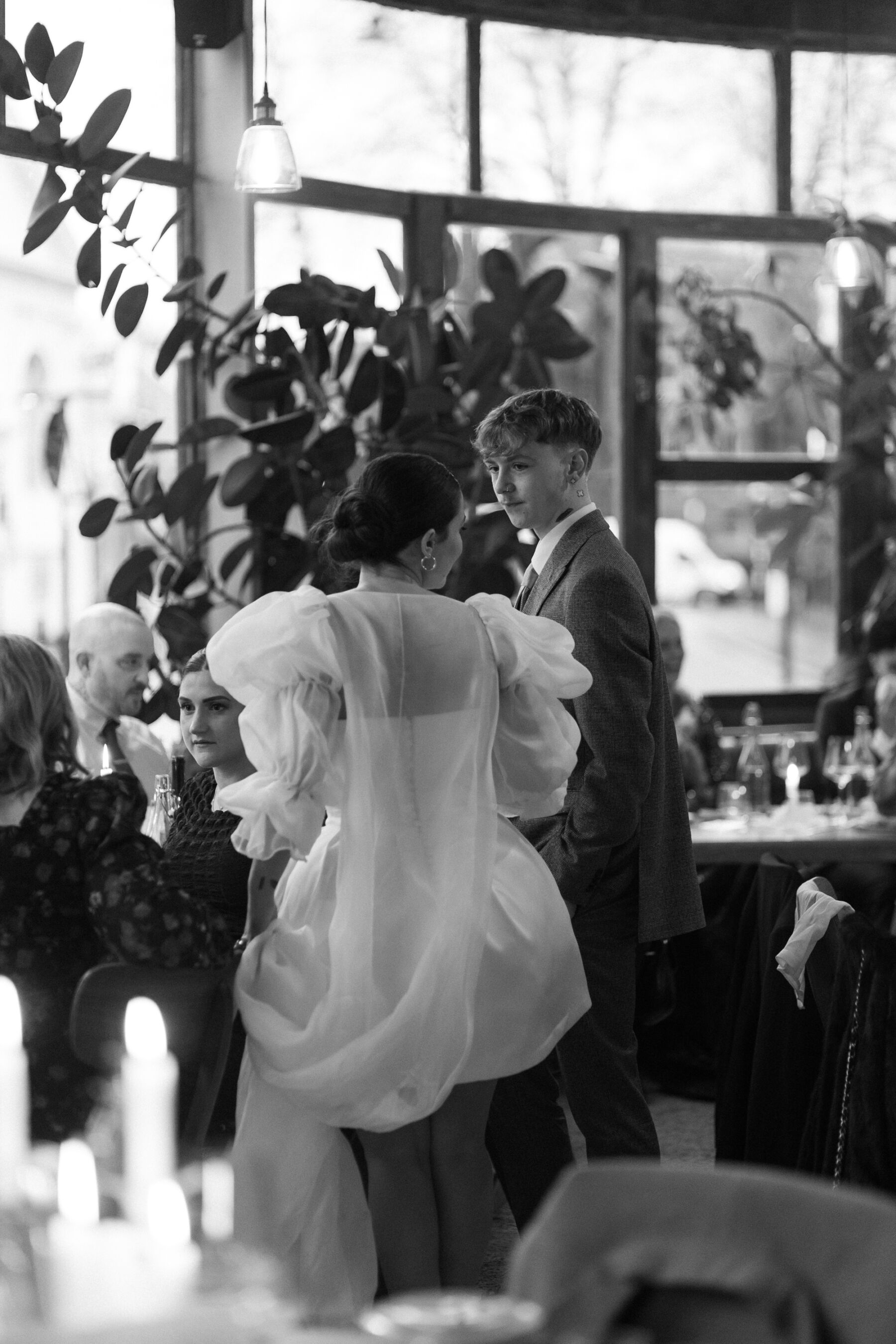 Maddy & Nik’s Cosy and Intimate Winter Wedding with a Custom Jesus Peiro Gown 33 Bride in a mini dress at Perilla in Stoke Newington. Modern restaurant wedding venue.