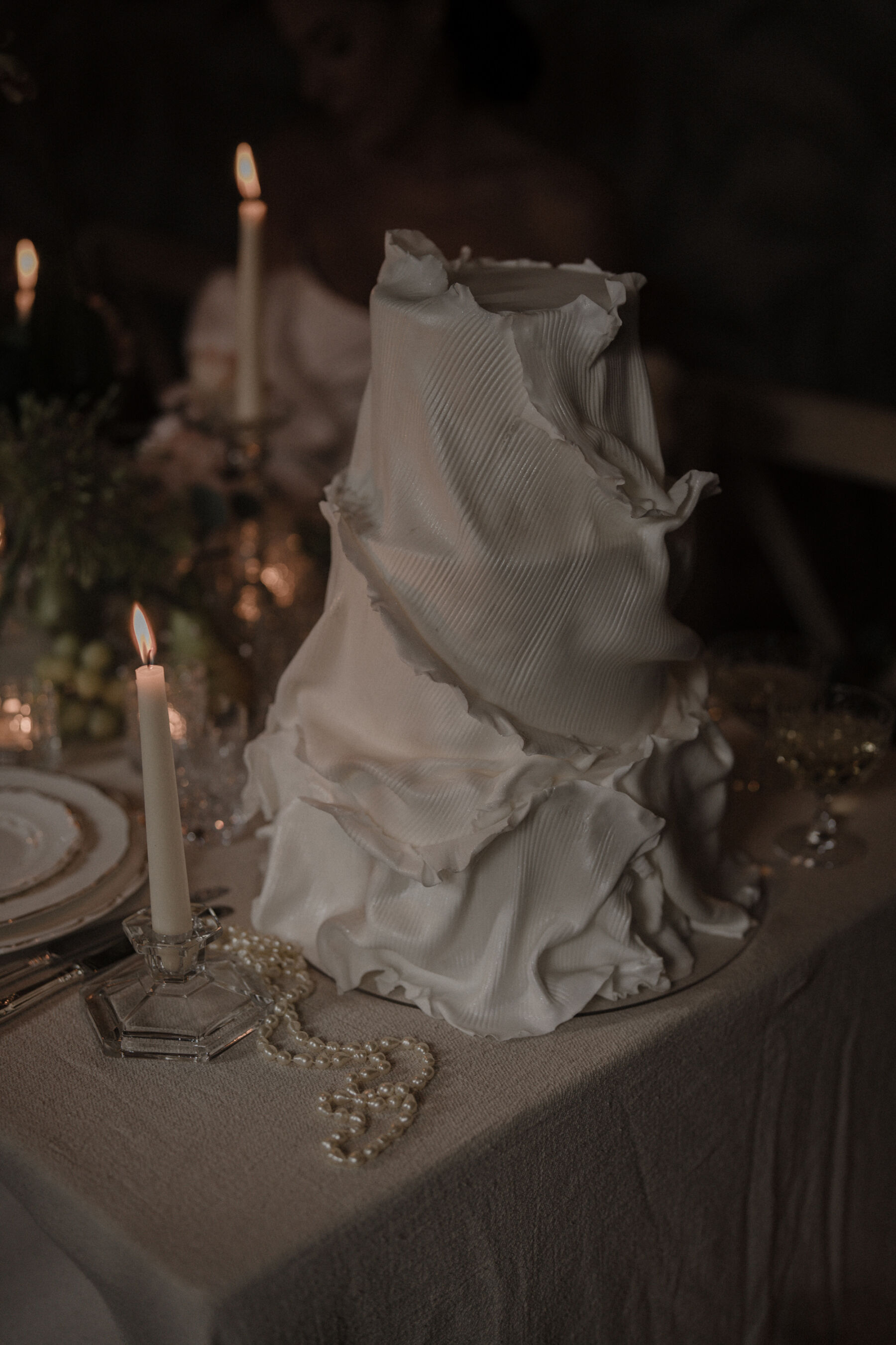 Wedding cake that looks like draped fabric.
