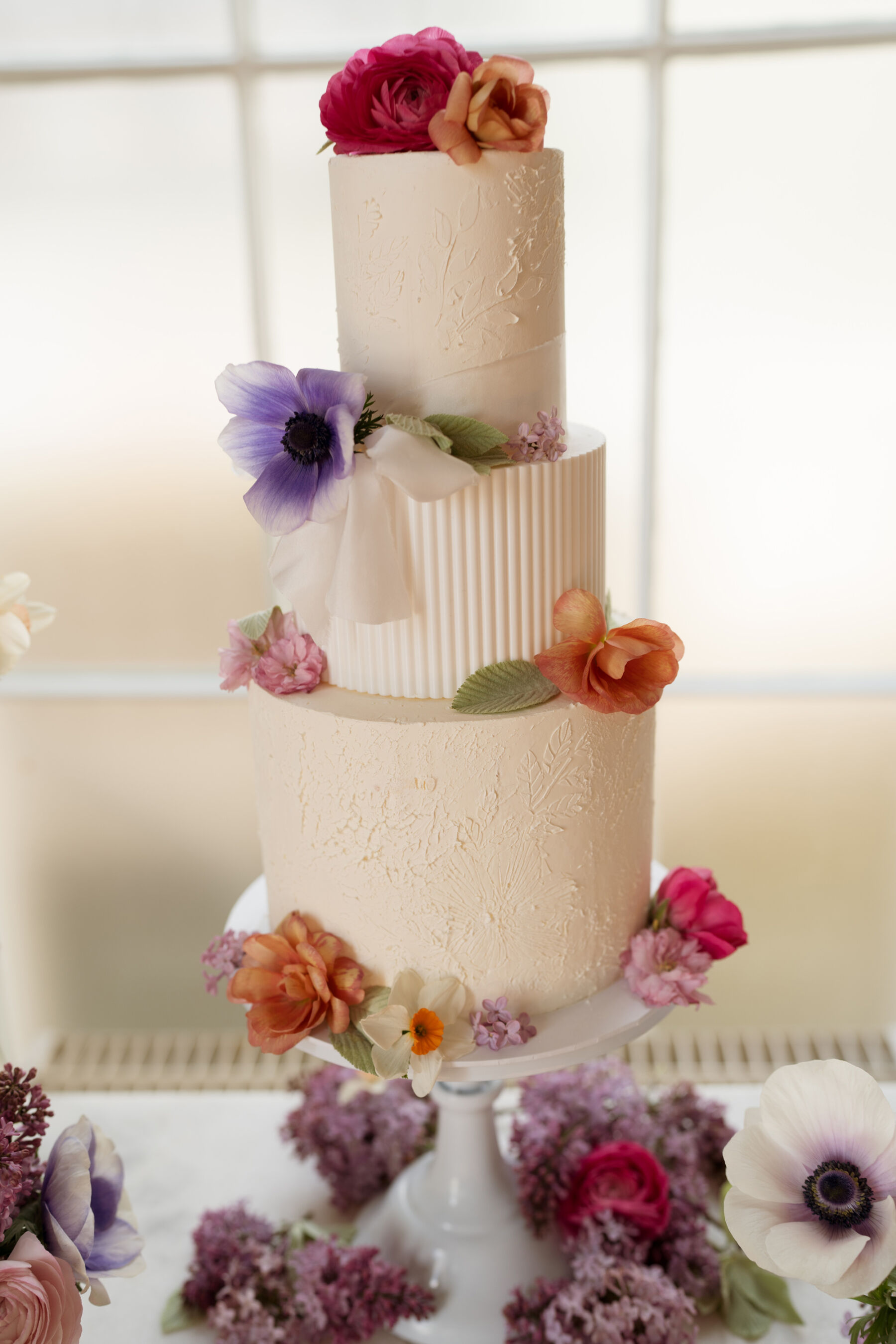 Modern 3 tier wedding cake with Icelandic Poppies.