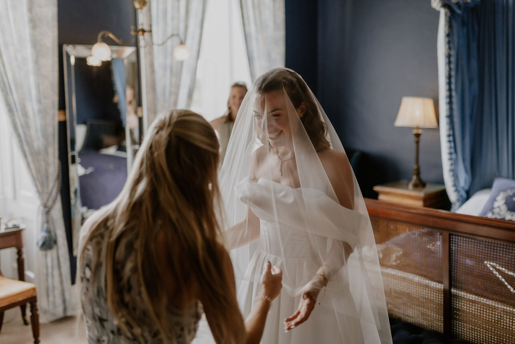An Investment Banker & Her Prestwold Hall Wedding, with a Milla Nova Gown & Berta Legging Boots 14 Bride getting changed into her Milla Nova wedding dress and veil at Prestwold Hall.