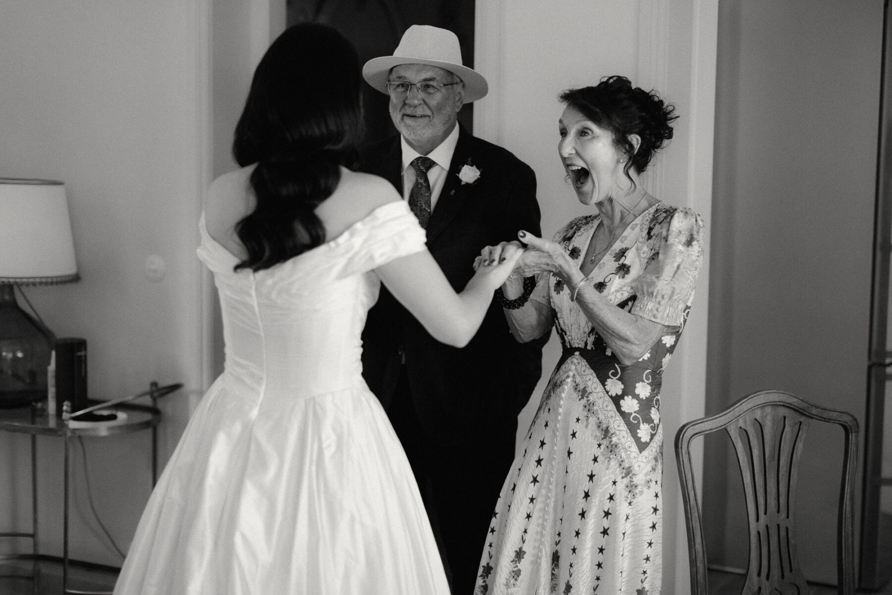 Olivia & Tim's Classy & Elegant Vineyard Wedding in Portugal 20 Bride's mum and dad get a first look of the wedding dress.