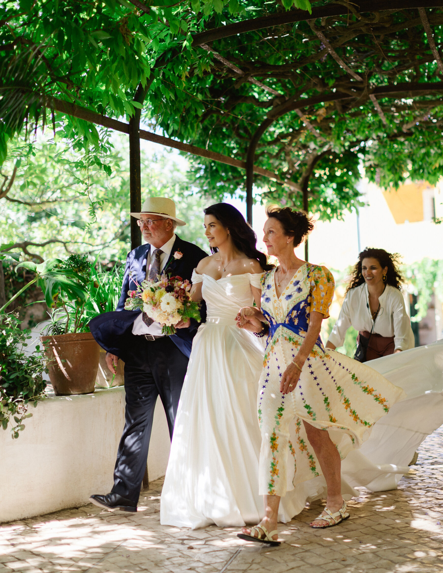 Olivia & Tim's Classy & Elegant Vineyard Wedding in Portugal 23 Parents of the bride accompanying their daughter to her outdoor wedding in Portugal.