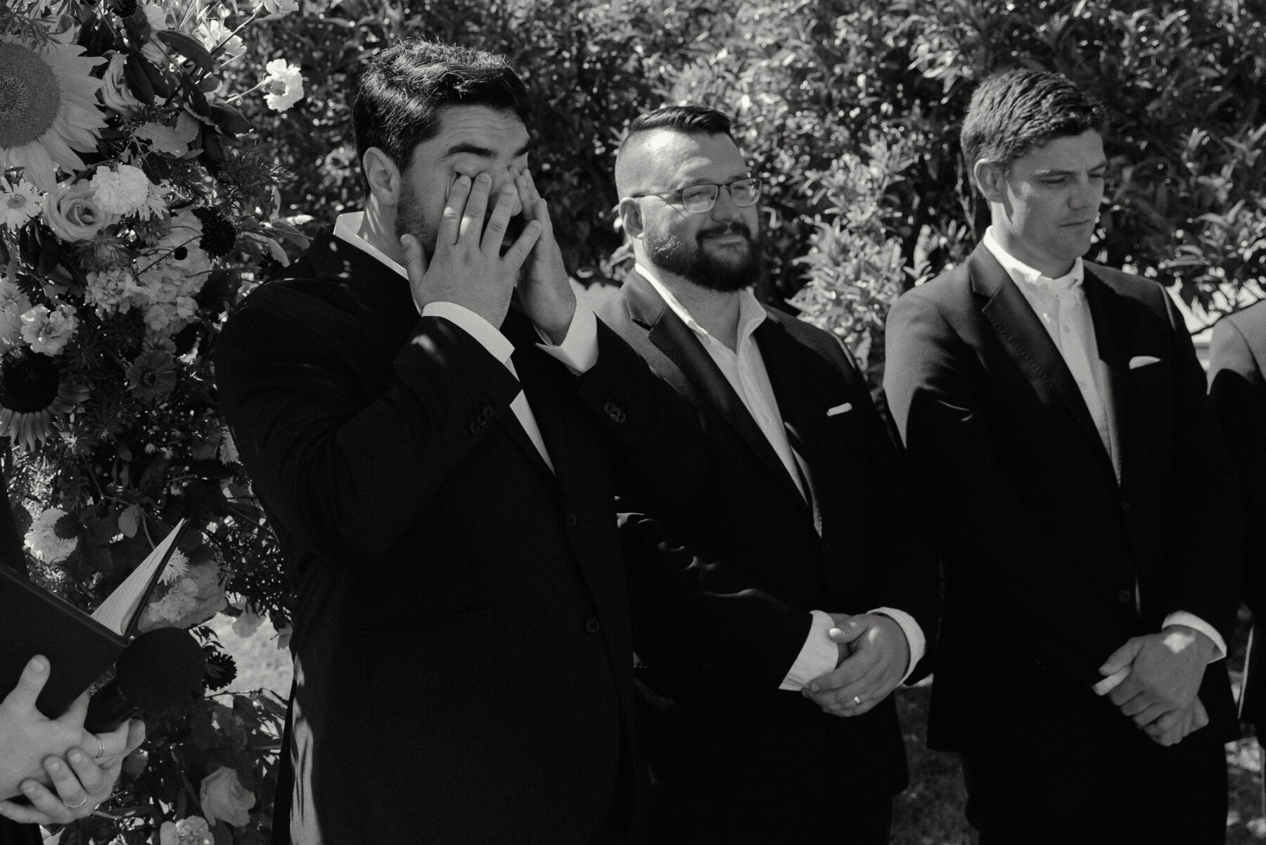 Olivia & Tim's Classy & Elegant Vineyard Wedding in Portugal 24 Groom wiping his tears after watching his bride arrive for their wedding ceremony.