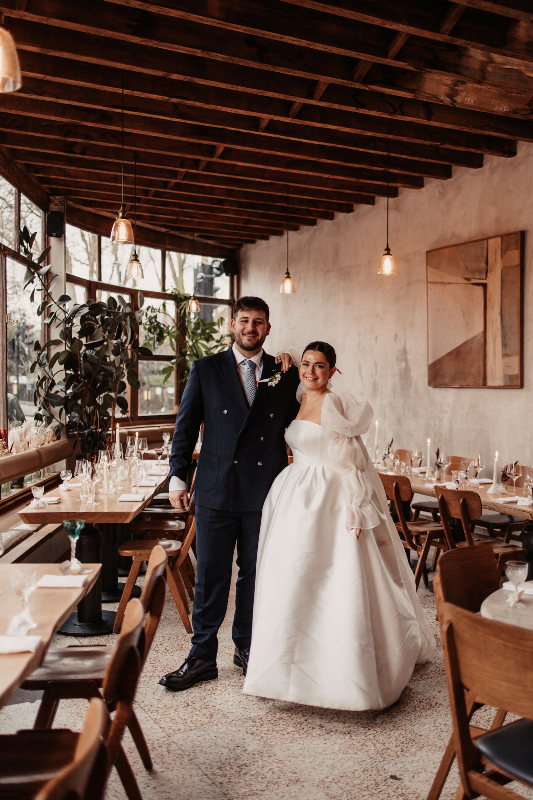 Maddy & Nik’s Cosy and Intimate Winter Wedding with a Custom Jesus Peiro Gown 25 Bride at groom at their wedding venue, Perilla, in Stoke Newington.