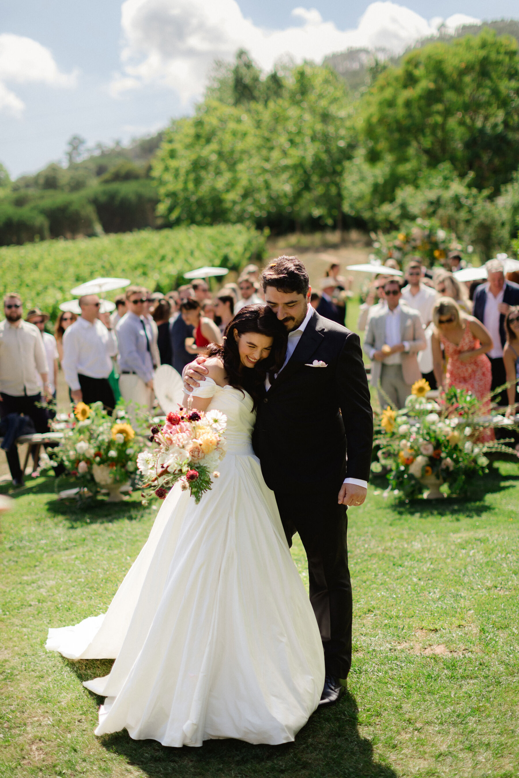 Olivia & Tim's Classy & Elegant Vineyard Wedding in Portugal 27 Bride and groom just married after their outdoor wedding ceremony in Portugal.