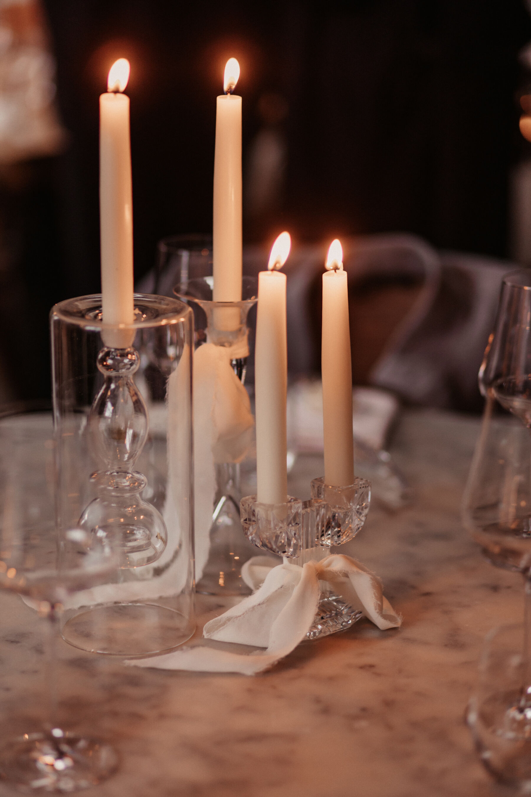 Maddy & Nik’s Cosy and Intimate Winter Wedding with a Custom Jesus Peiro Gown 24 Simple and elegant taper candles in glass candle holders with silk ribbons.