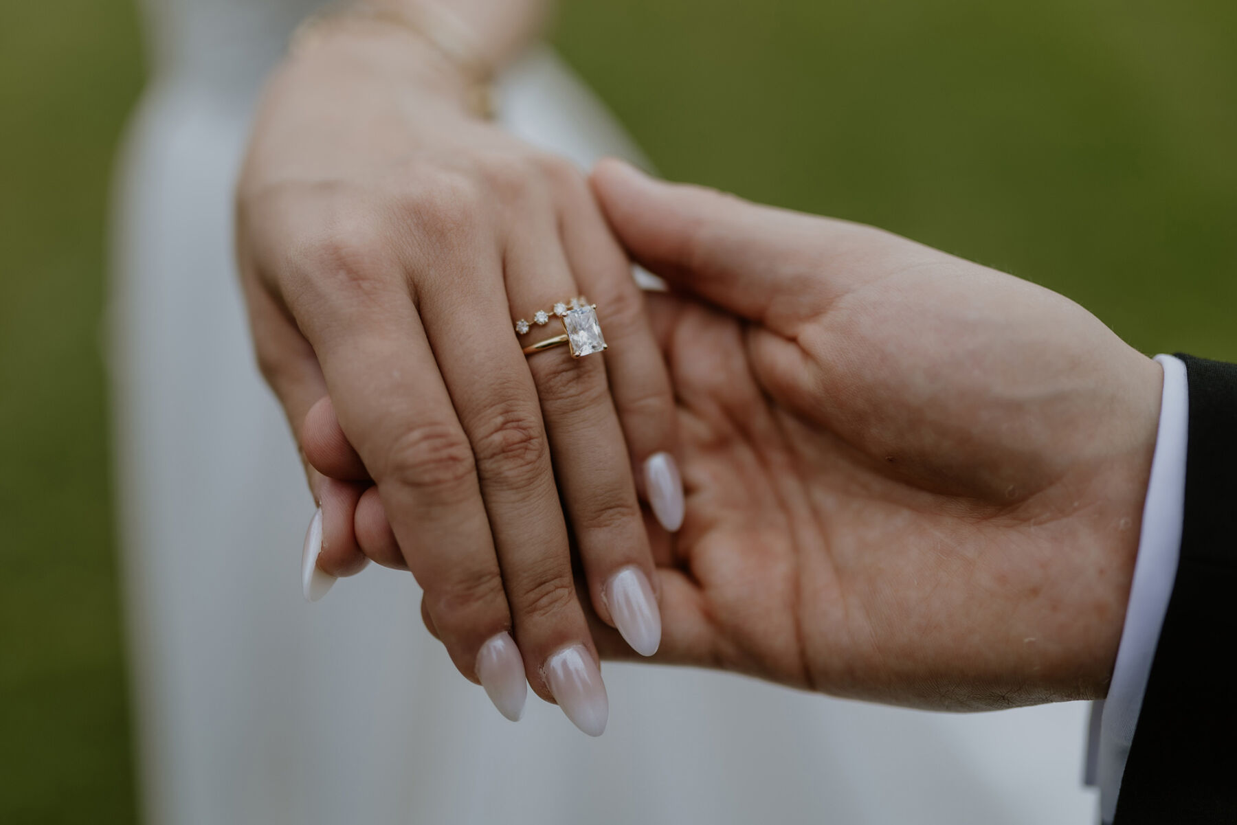 An Investment Banker & Her Prestwold Hall Wedding, with a Milla Nova Gown & Berta Legging Boots 27 Close up photograph of the bride's wedding and engagement ring.