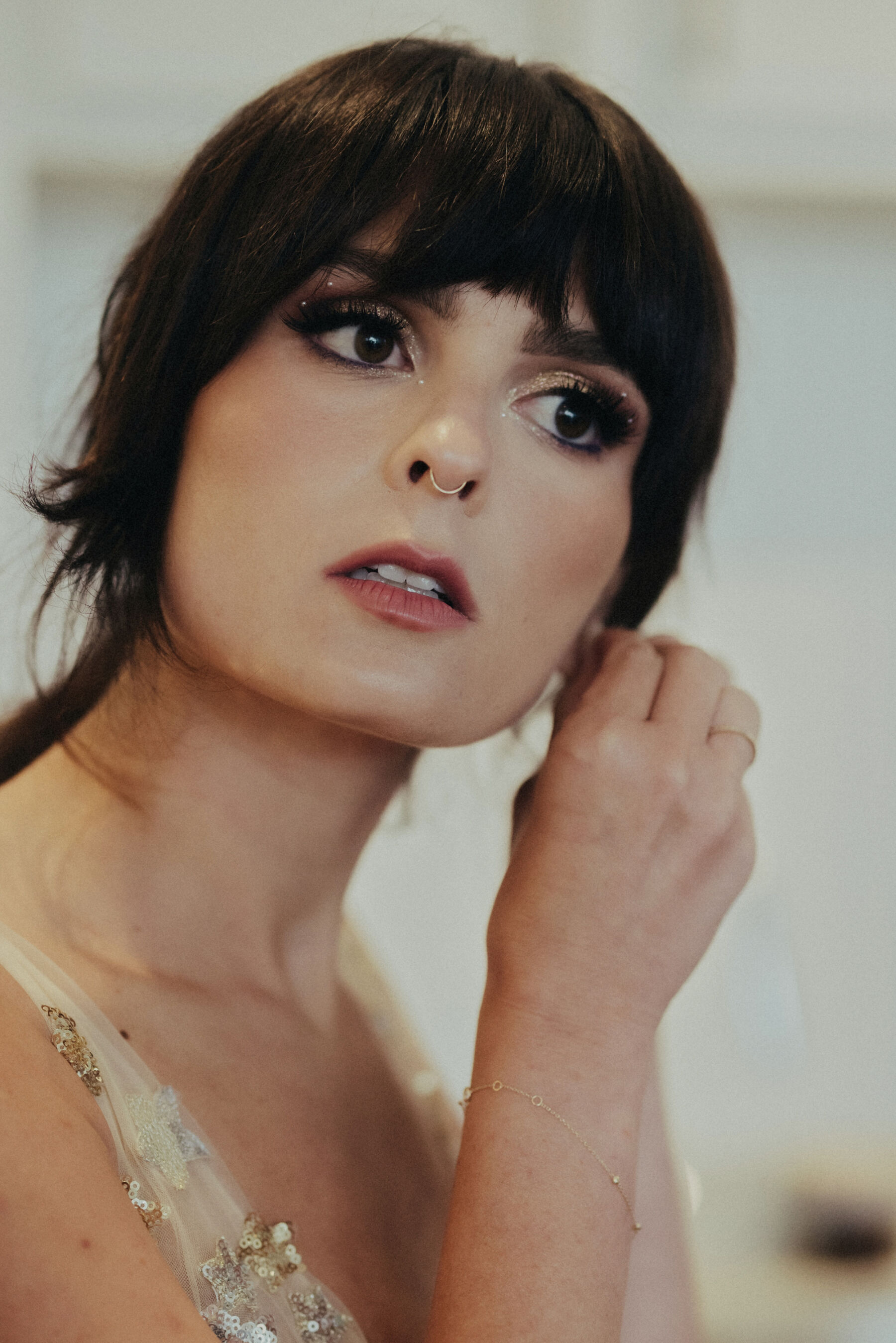 Bride with a nose ring and celestial inspired wedding dress.