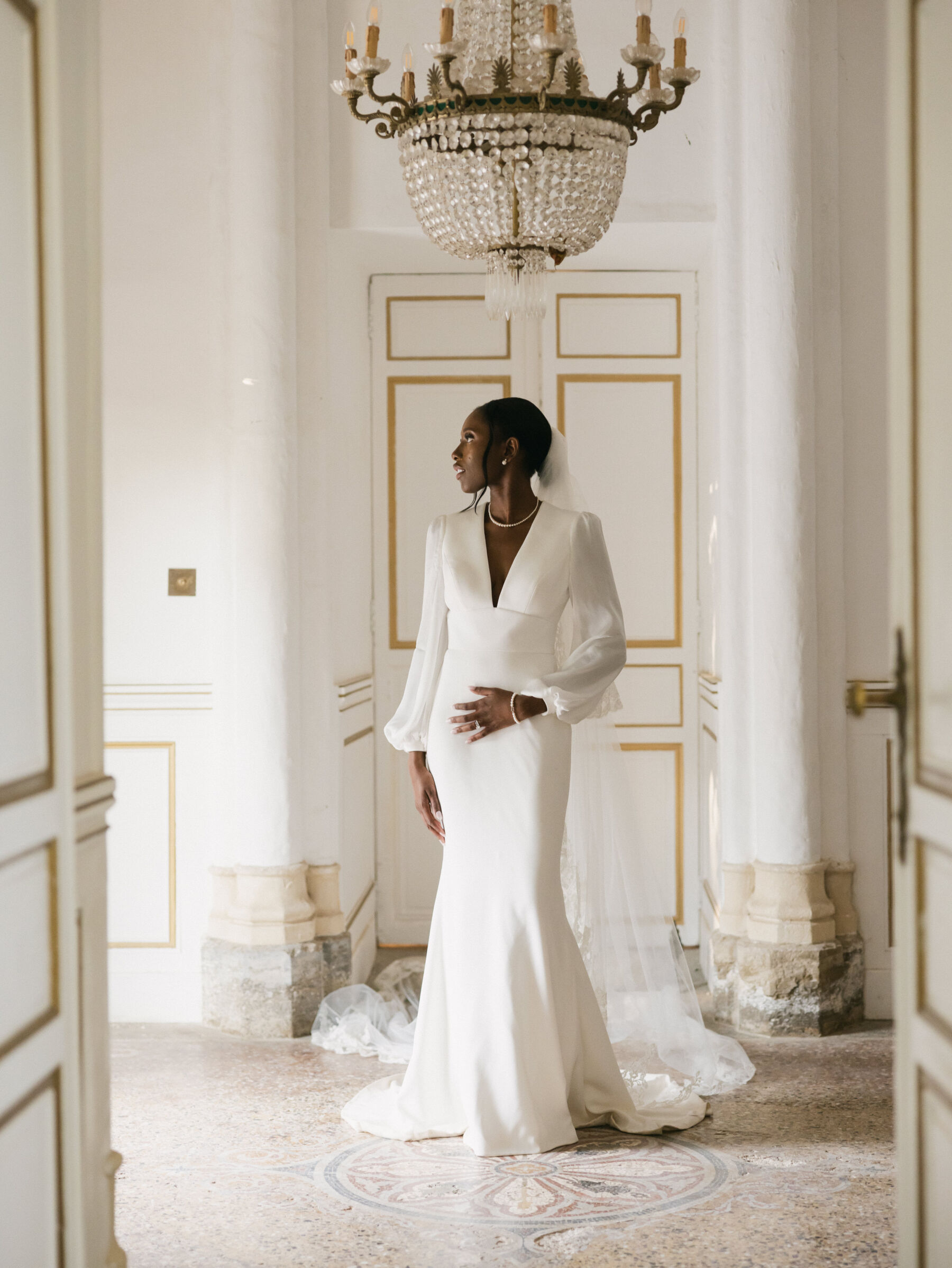 French Riviera Chic Wedding at Château Robernier, Provence, with Lawyer Chanel in Sassi Holford 14 Black bride wearing a Sassi Holford dress and pearl necklace. Wedding at Chateau Robernier in Cotignac, Provence, France. Sébastien Boudot Photography.