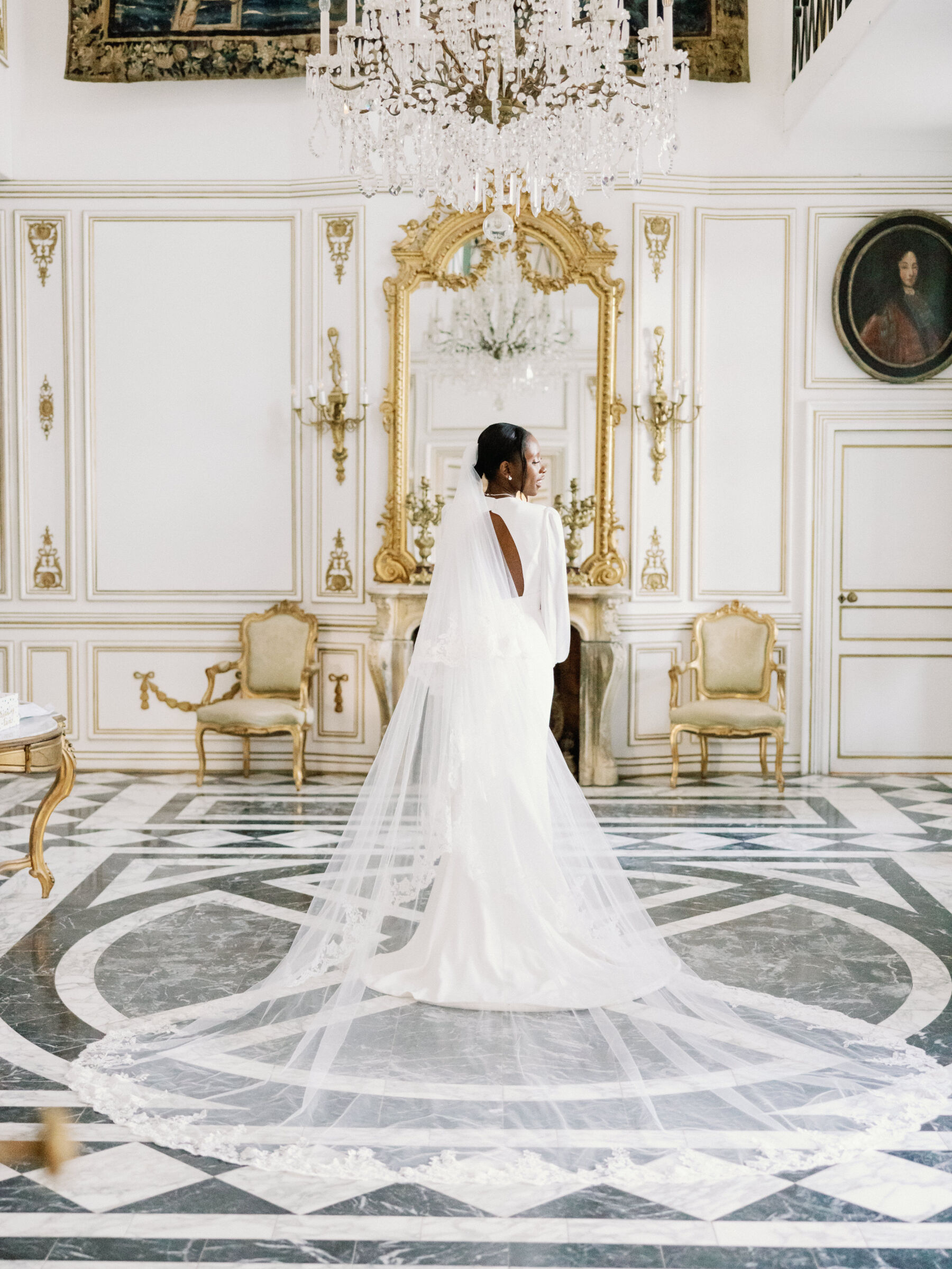 French Riviera Chic Wedding at Château Robernier, Provence, with Lawyer Chanel in Sassi Holford 20 Black bride wearing a Sassi Holford dress and long veil with lace trim. Wedding at Chateau Robernier in Cotignac, Provence, France. Sébastien Boudot Photography.