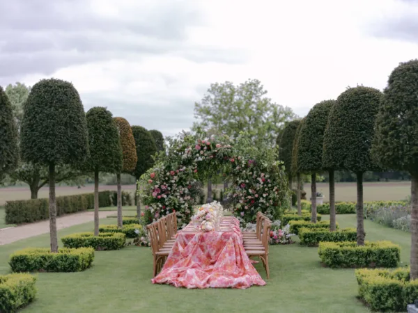 Bold Pink pattern hydrangea tablecloth used for a colourful wedding tablescape
