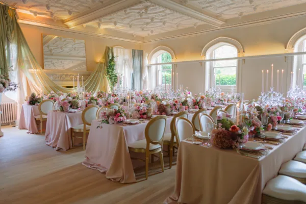 A full wedding set-up using blush pink tablecloths