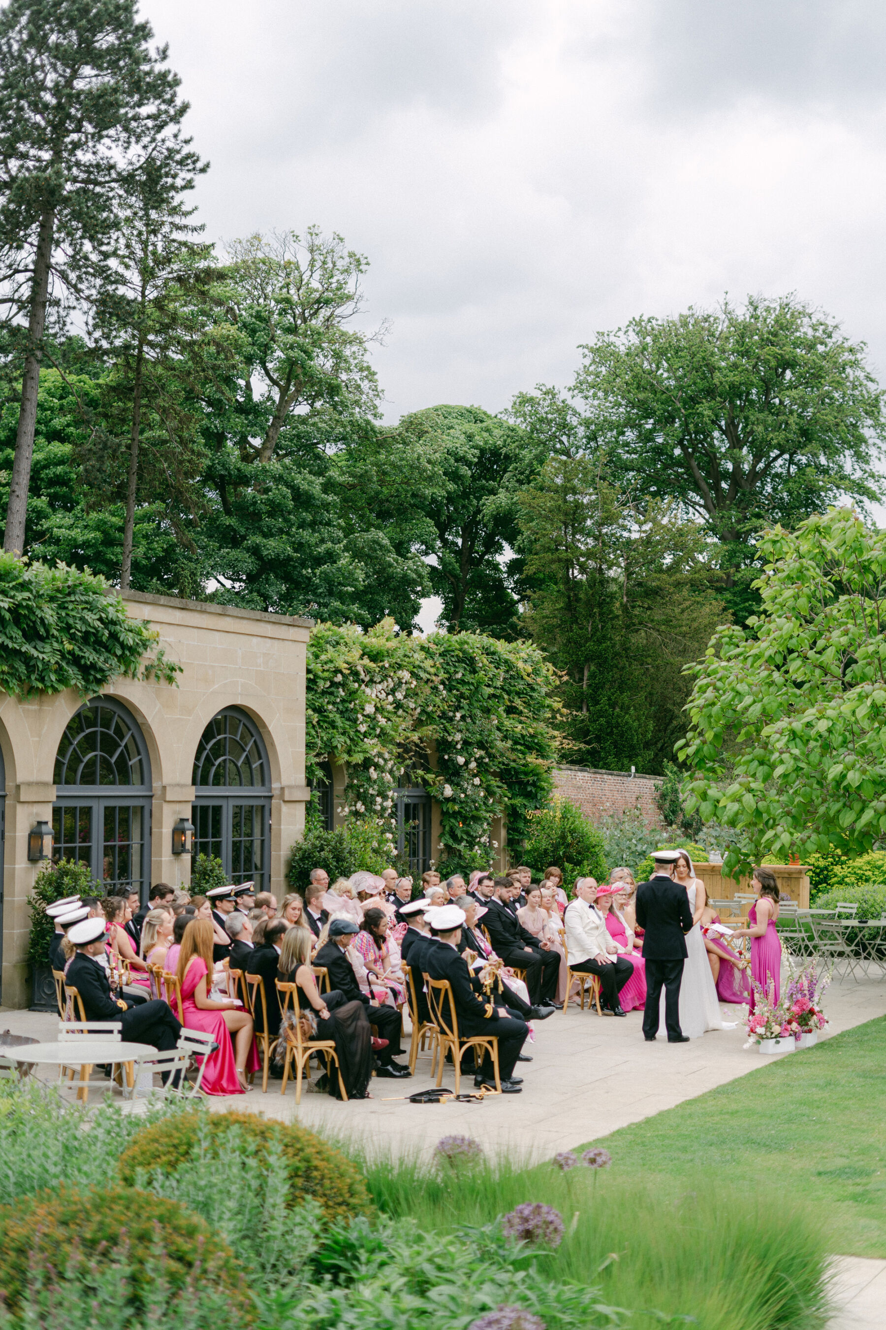 Wedding outdoors by the Fig House at Middleton Lodge.