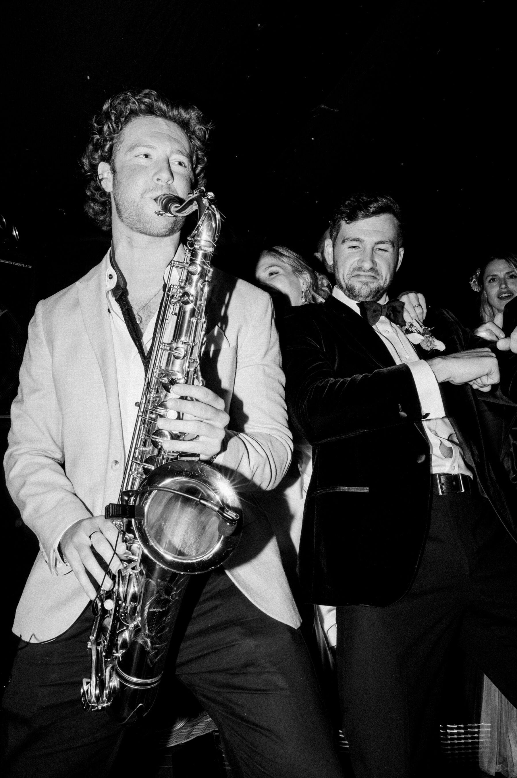 Lucy in Pronovias For Her Beautiful Broadfield Court Wedding 37 Saxophonist playing at a wedding.