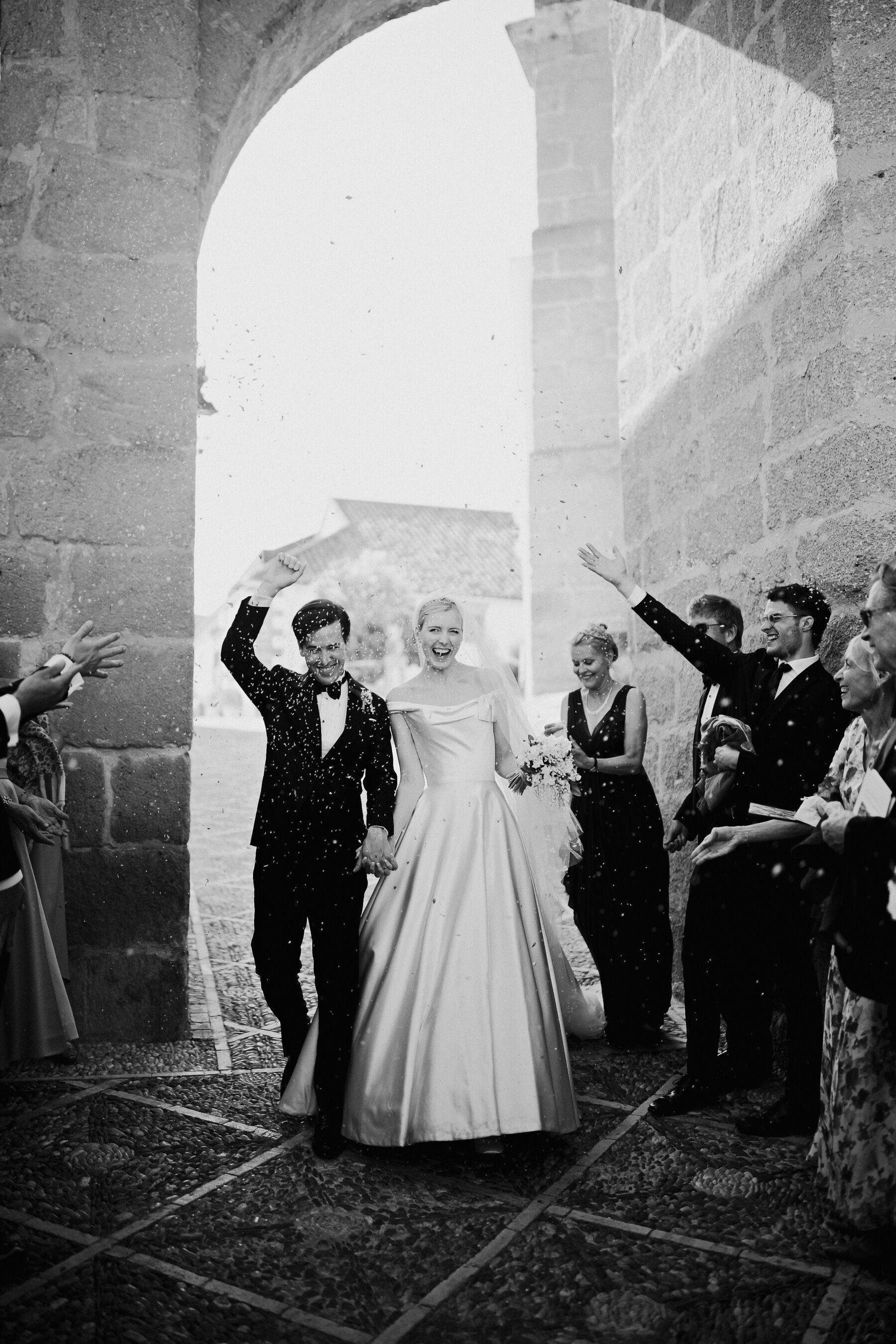 Alexandra Wore Phillipa Lepley For Her Romantic Destination Wedding in Spain 21 Jubilant bride and groom having just got married in Spain. They are being showered in confetti as they leave the church. The bride wears Phillipa Lepley, the groom wears black tie and tuxedo.
