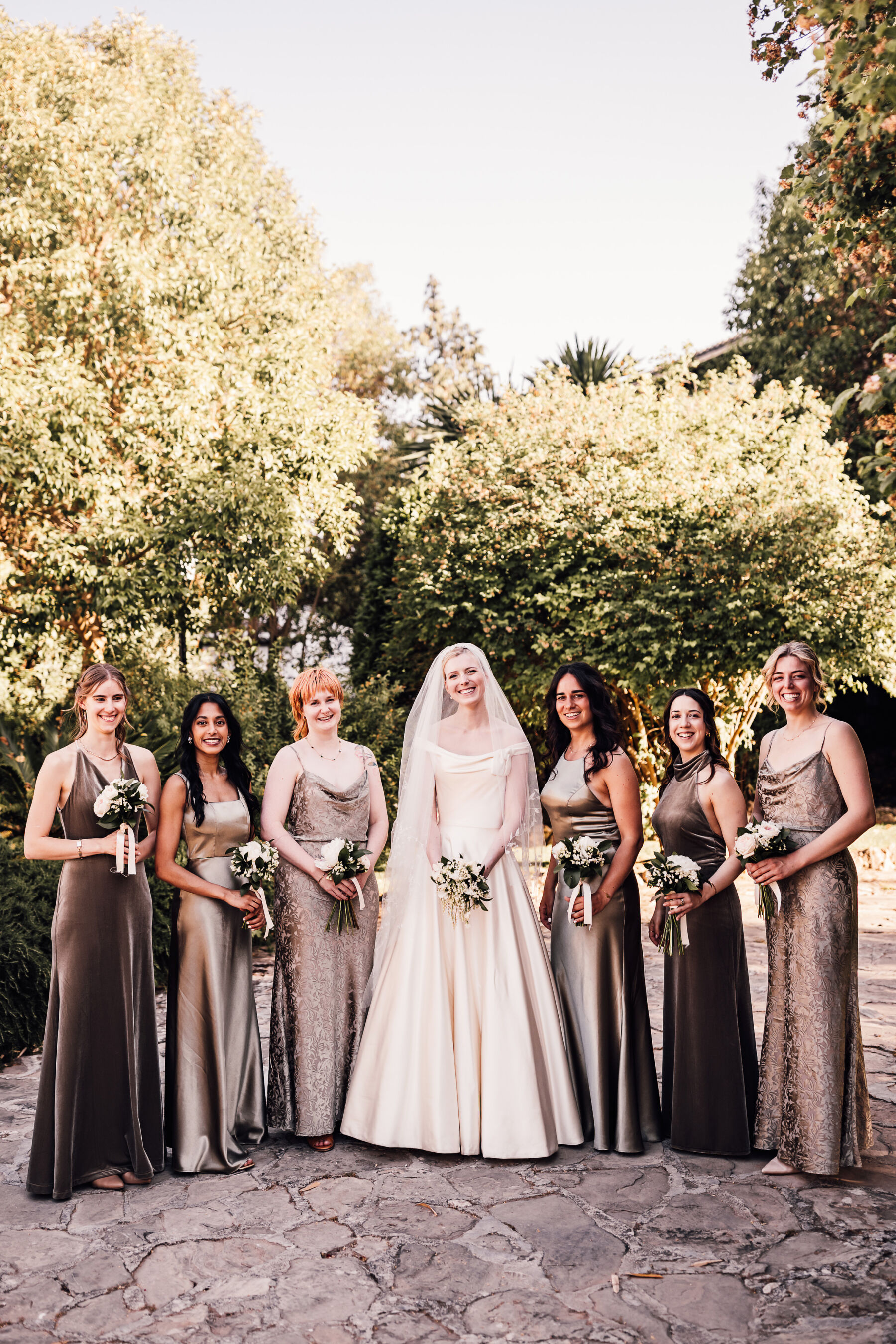 Alexandra Wore Phillipa Lepley For Her Romantic Destination Wedding in Spain 20 Elegant bride wearing Phillipa Lepley couture wedding dress. Her bridesmaids wear a variety of brown silk Jenny Yoo dresses.