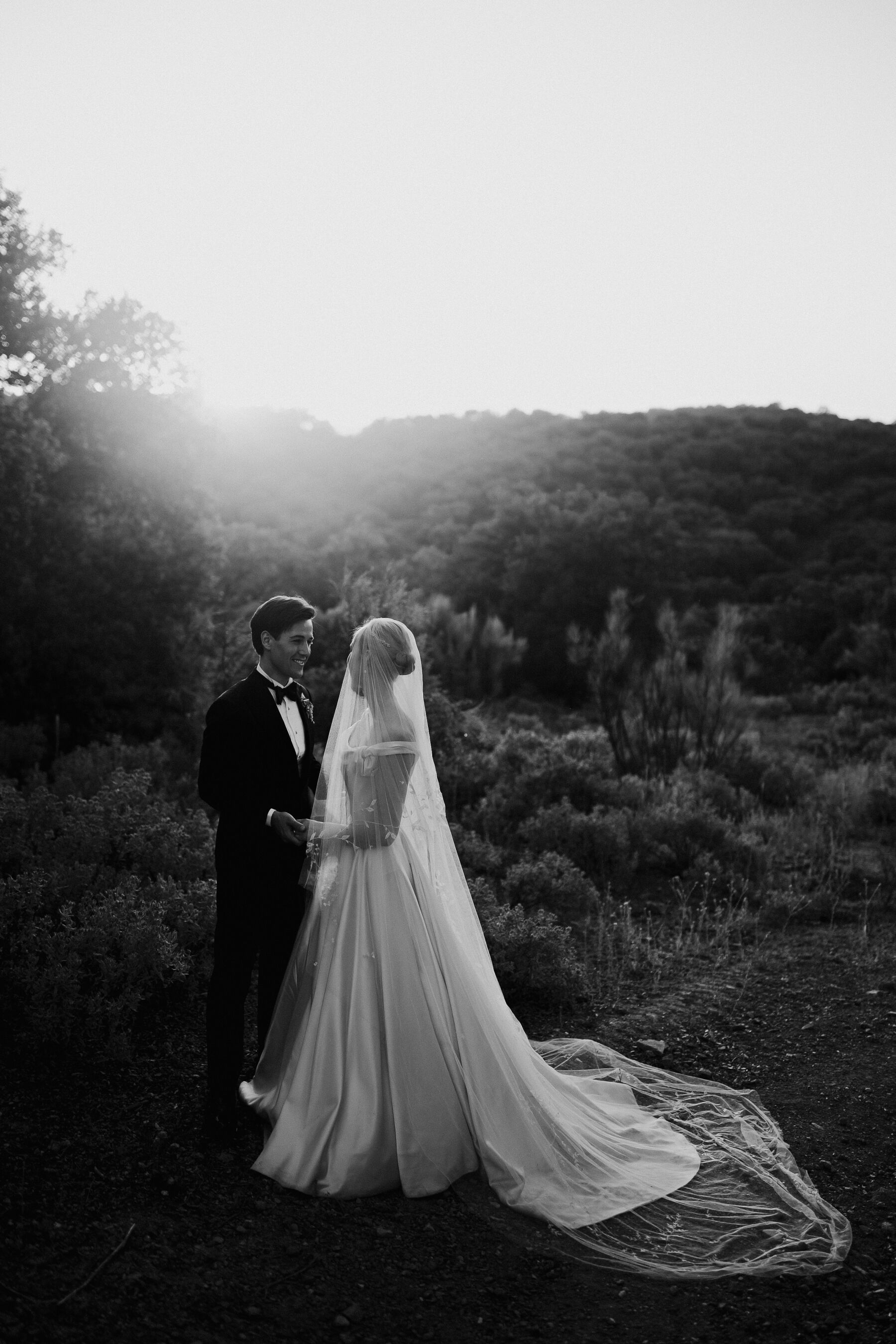 Alexandra Wore Phillipa Lepley For Her Romantic Destination Wedding in Spain 40 Elegant black and white portrait of bride and groom at sunset on their wedding day in Spain. Groom wears a tuxedo and the bride wears a Phillipa Lepley wedding dress.