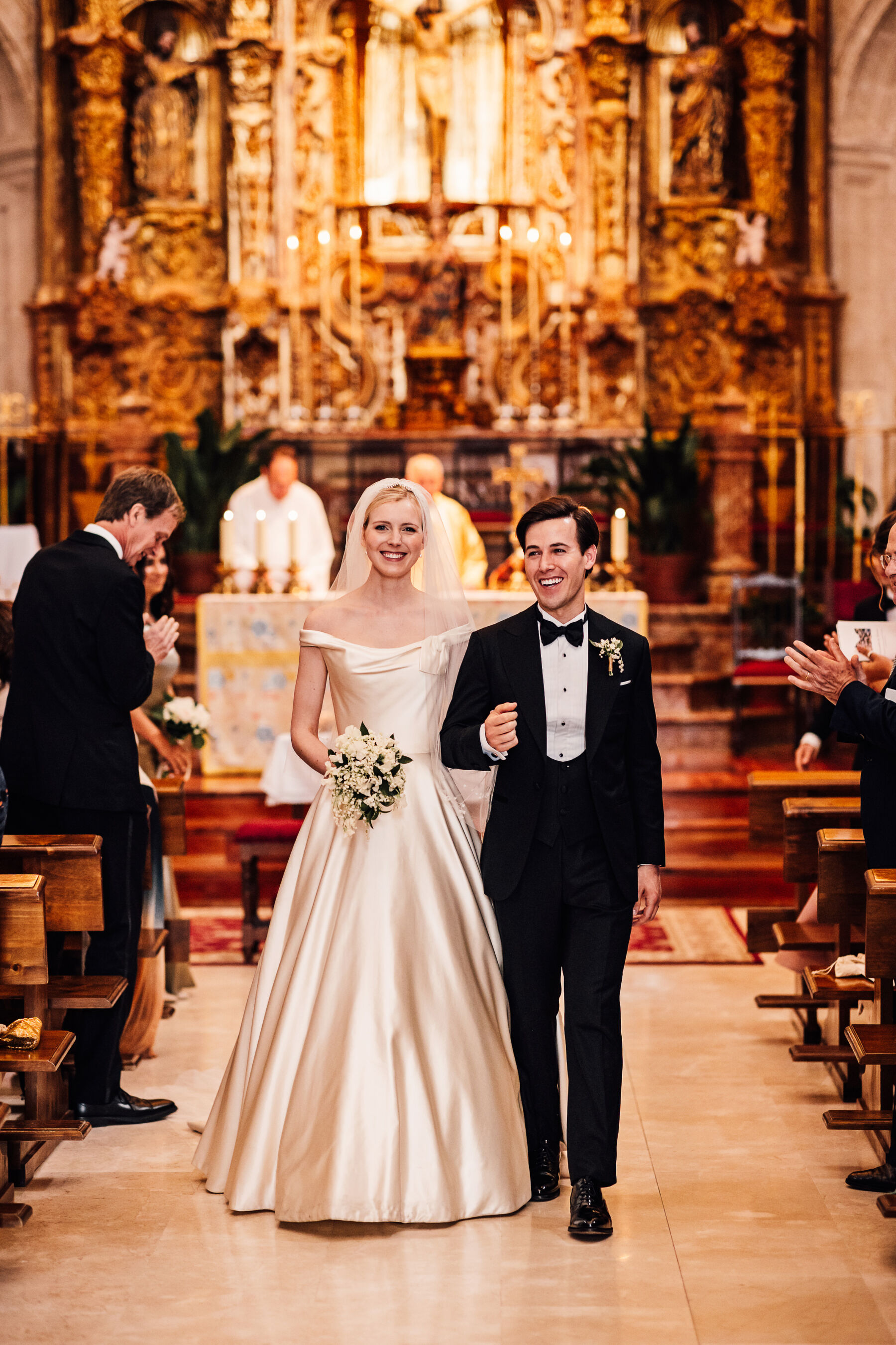 Alexandra Wore Phillipa Lepley For Her Romantic Destination Wedding in Spain 26 Bride and groom exiting their church wedding ceremony in Spain. She wears Phillipa Lepley - the groom is in black tie tuxedo.