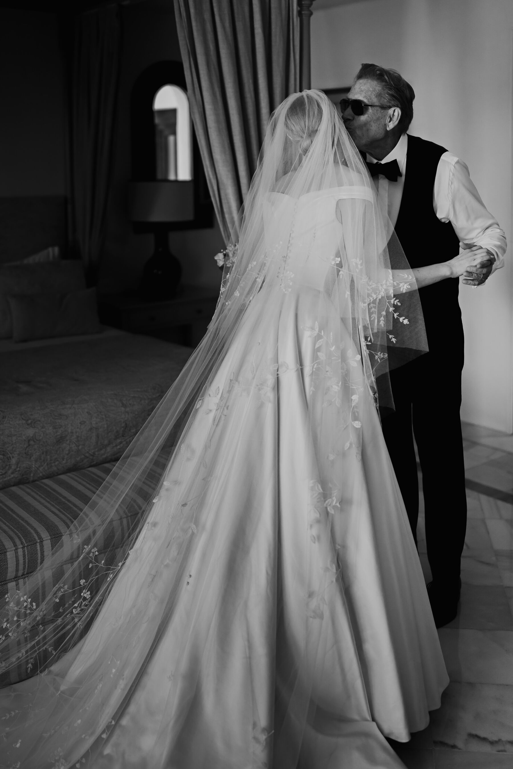 Alexandra Wore Phillipa Lepley For Her Romantic Destination Wedding in Spain 18 Bride embracing her father on the morning of her wedding. She wears a couture Phillipa Lepley bridal gown and wedding veil.