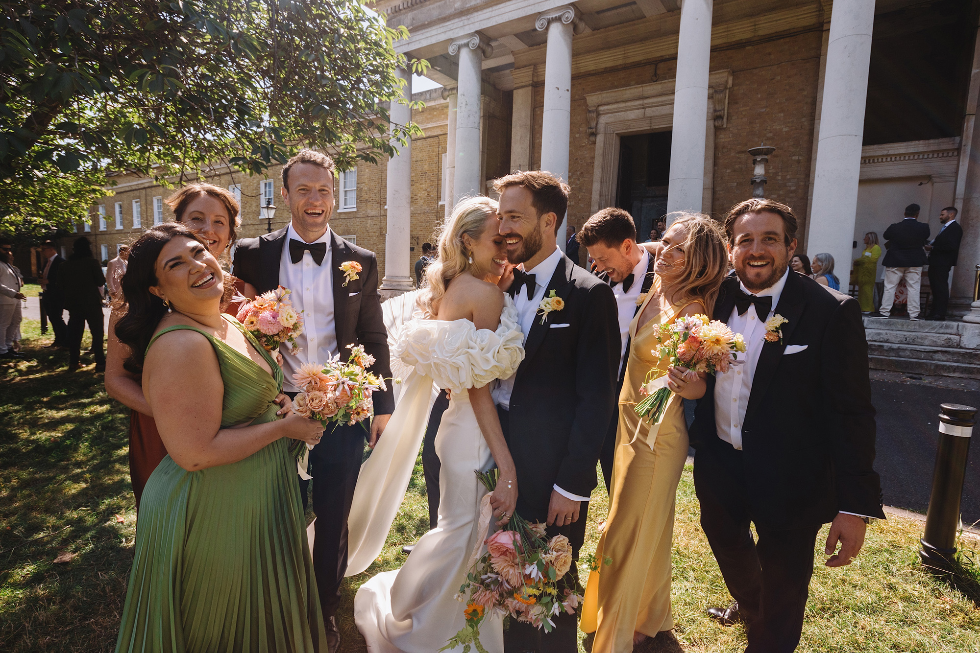 Bride with long blonde wavy hair wearing an Eva Lendel wedding dress with frilly sleeves. Wolf & Co Photography.