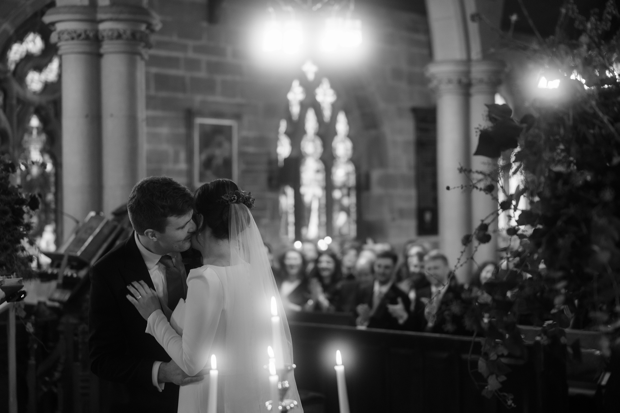 A Movie & Literary Inspired Romantic Christmas Wedding 50 Bride and groom during their Christmas wedding ceremony at church.