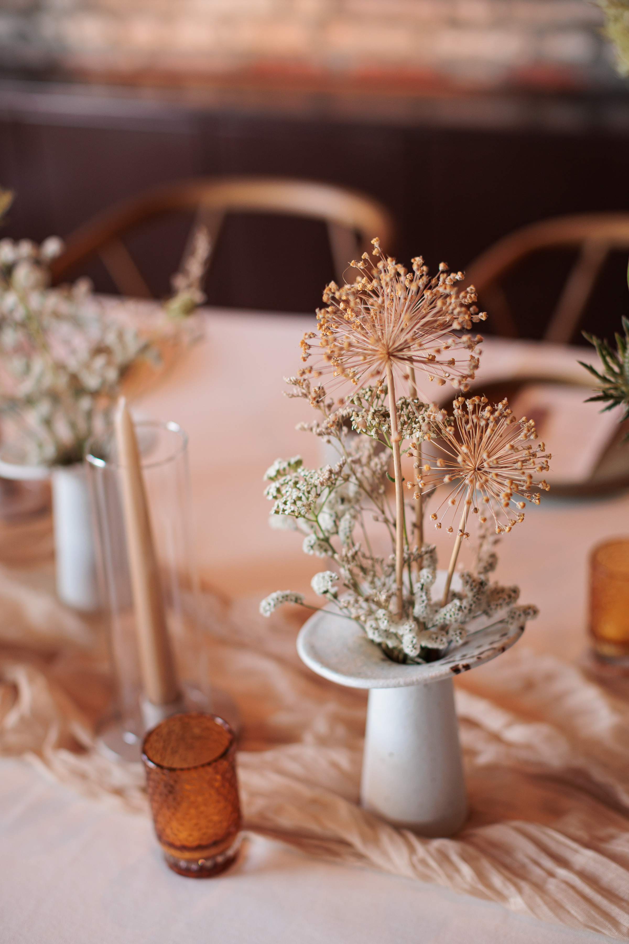 Danielle Frankel Intimate Italian Wedding 38 - Kathryn in Danielle Frankel for her Intimate Italian Wedding Dried flowers in modern ceramic vases - modern wedding table flowers.