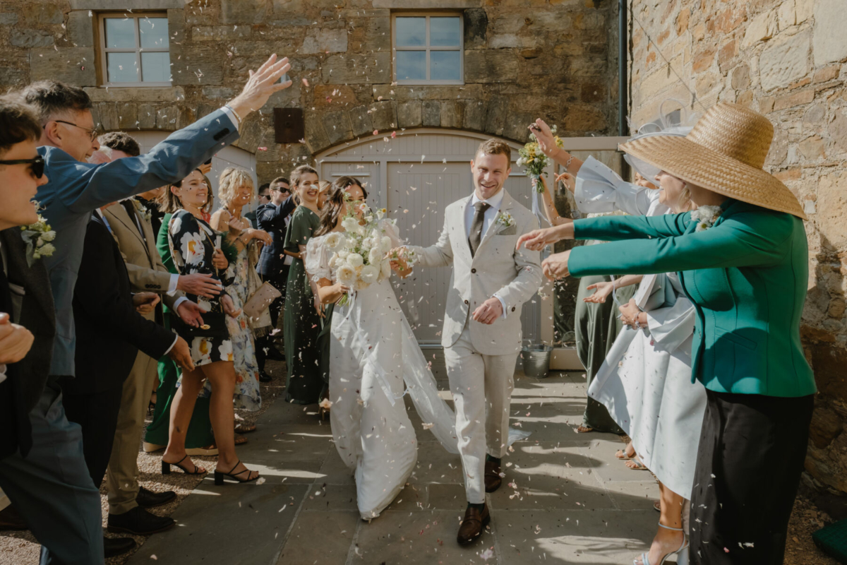 Harper Scott: Playful & Inventive Editorial Wedding Photography & Film 23 Bride & groom in a confetti shower. Harper Scott Photography - Scotland wedding photographer with creative, playful, inventive editorial style.