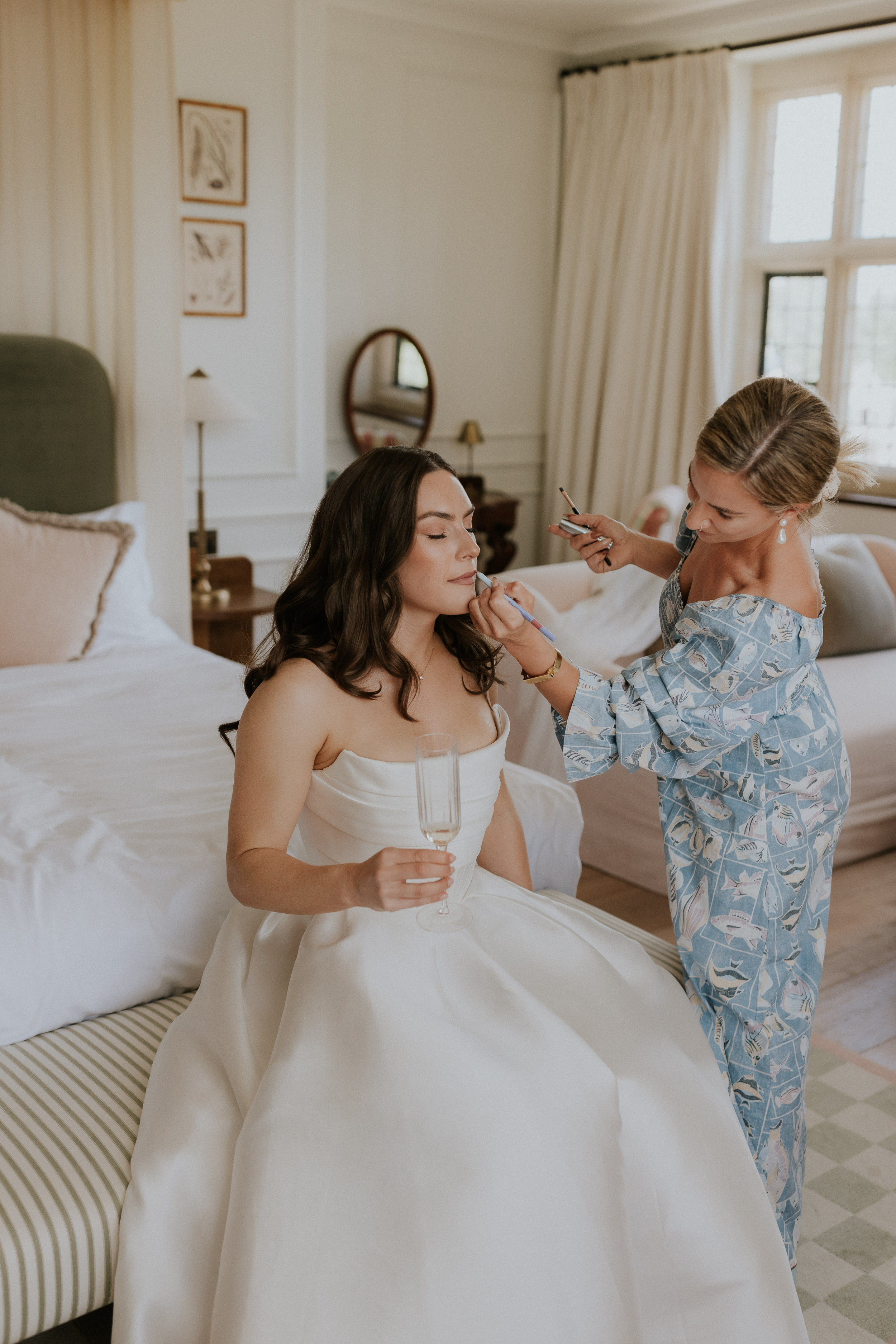 Bride having her makeup applied. She wears an Alex Perry wedding dress. King House wedding. Maja Tsolo Photography.