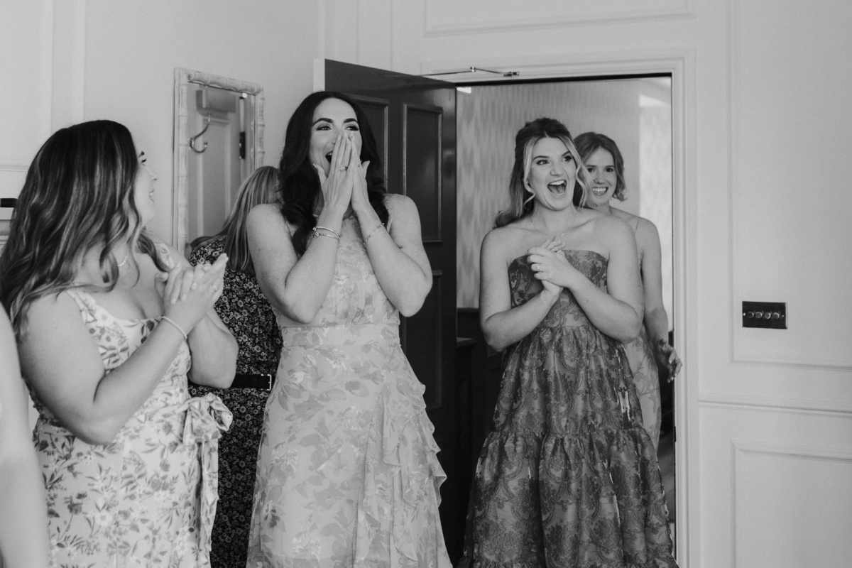 A Romantic Summer Wedding at Kin House in Wiltshire 30 Bridesmaids reaction seeing the bride in her dress for the first time. Maja Tsolo Photography.