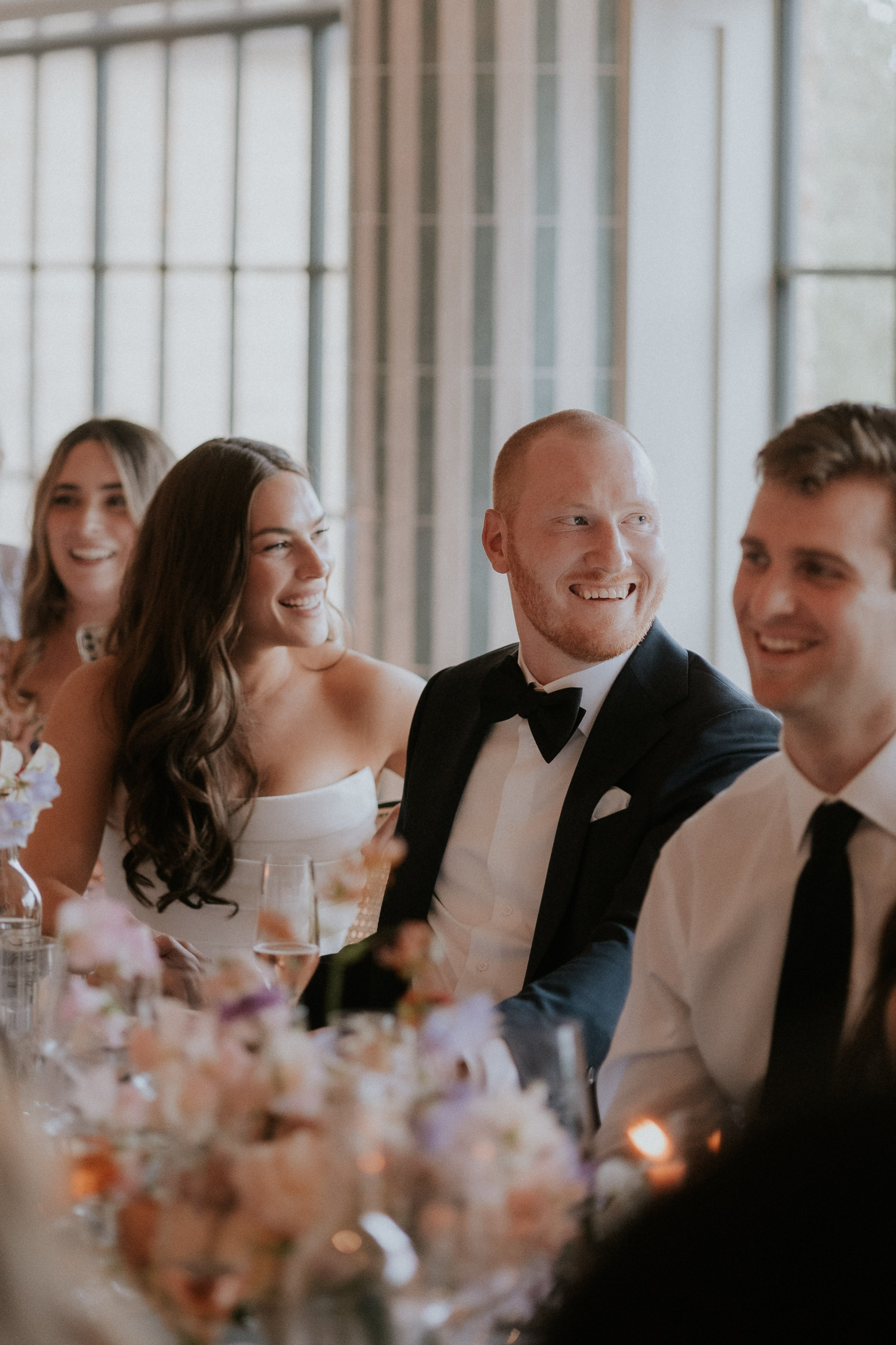Bride and groom happy. andlaughing during the wedding reception. Maja Tsolo Photography.