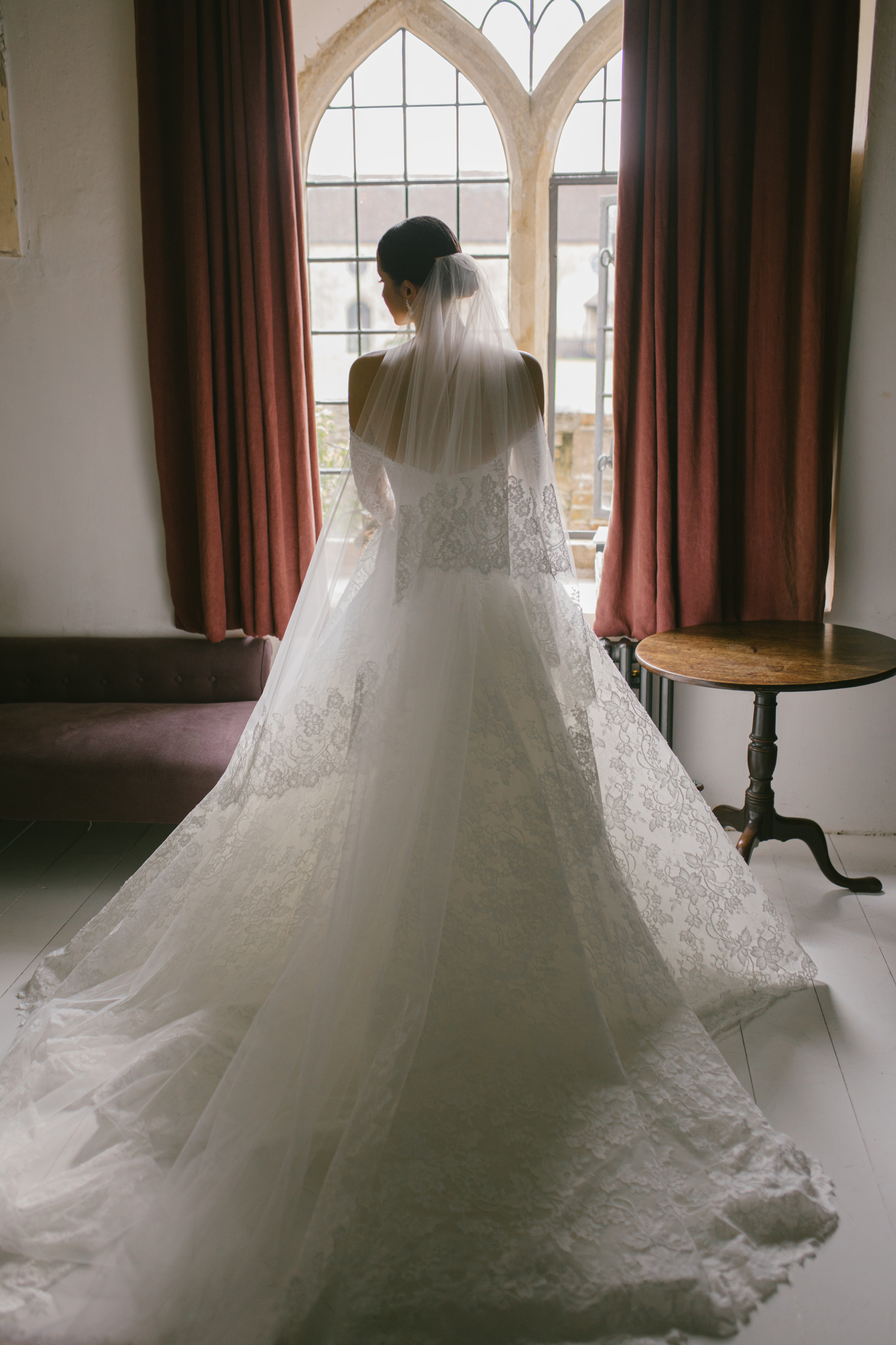 A Josephine Scott Bride & her Romantic Spring Wedding in Somerset 17 Elegant window light shot of bride wearing a Josephine Scott lace wedding dress and veil
