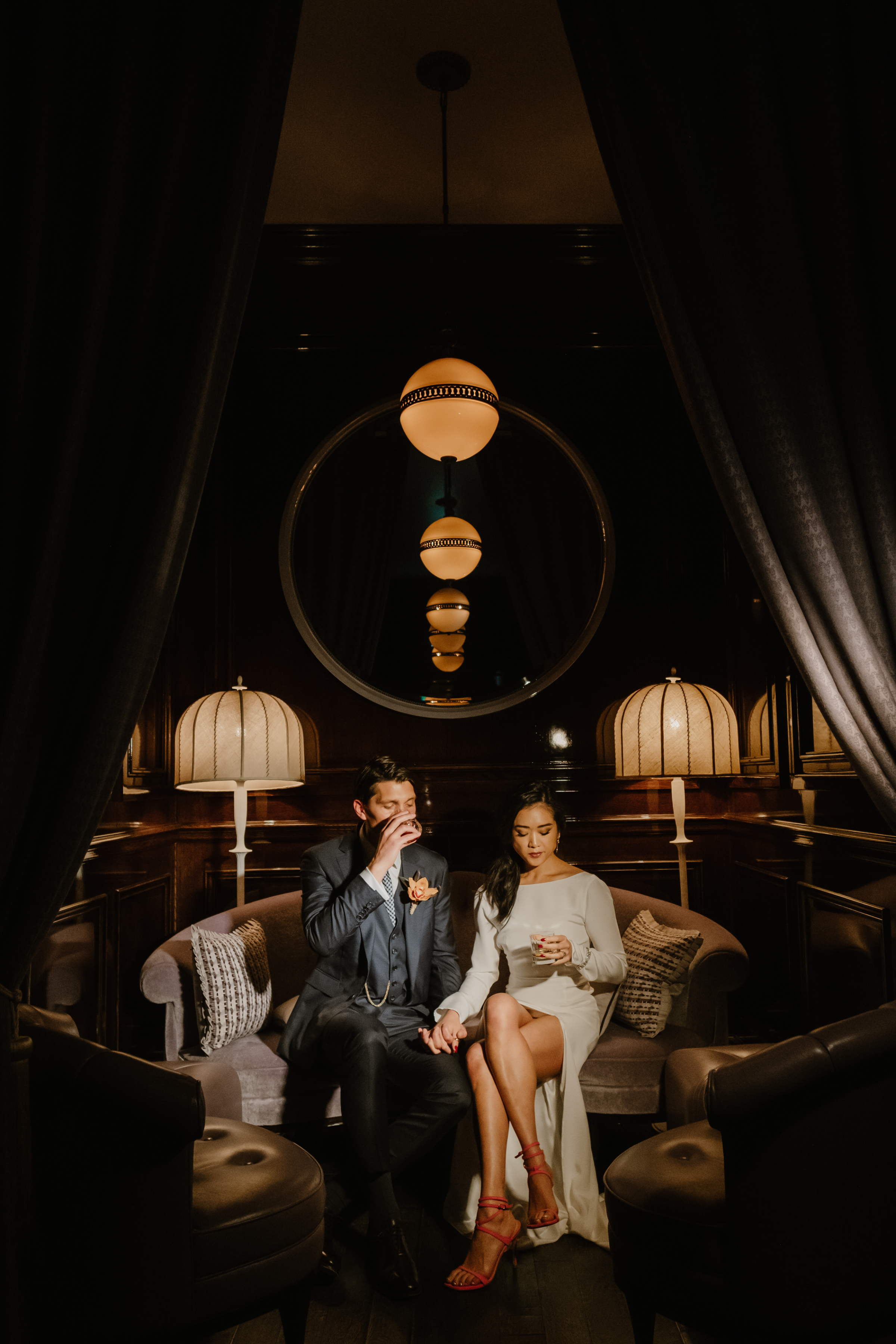 Amanda & Carl's Downton Abbey Meets Peaky Blinders Wedding Weekend at Gleneagles Hotel 27 Bride wearing a long sleeved Alexandra Grecco dress with a thigh slit that bares her legs. She wears pink strappy sandals. Groom in slate grey suit. Harper Scott Photography.