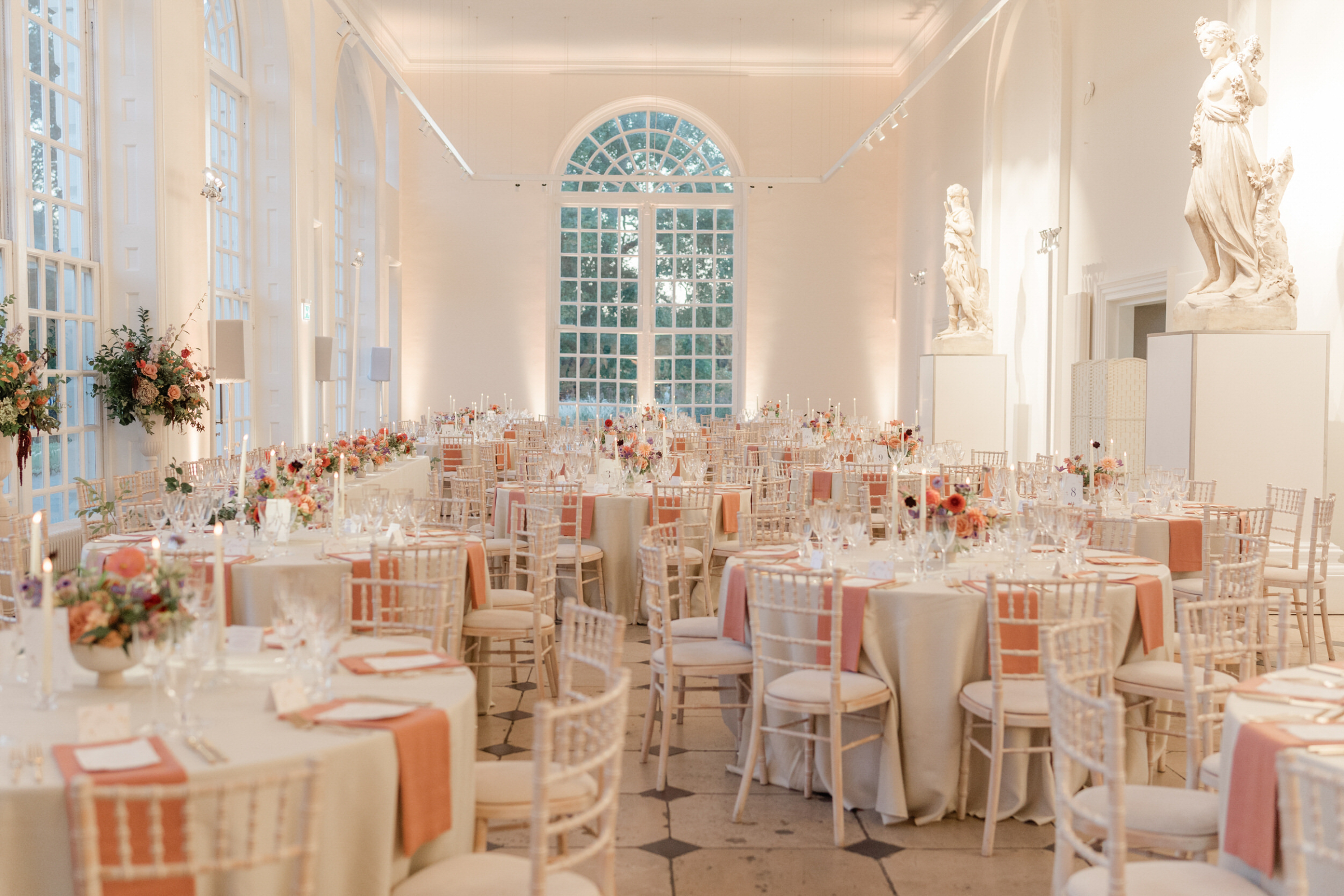A Dreamy Kew Gardens Glasshouse Wedding Planned by Rachel Dalton 38 Kew Gardens wedding reception set up with round tables and peach napkins.