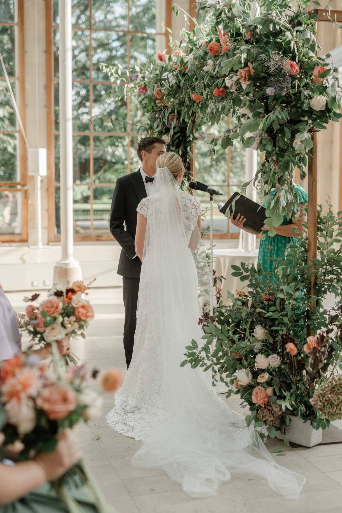 A Dreamy Kew Gardens Glasshouse Wedding Planned by Rachel Dalton 25 Bride and groom during their wedding reception at Kew Gardens