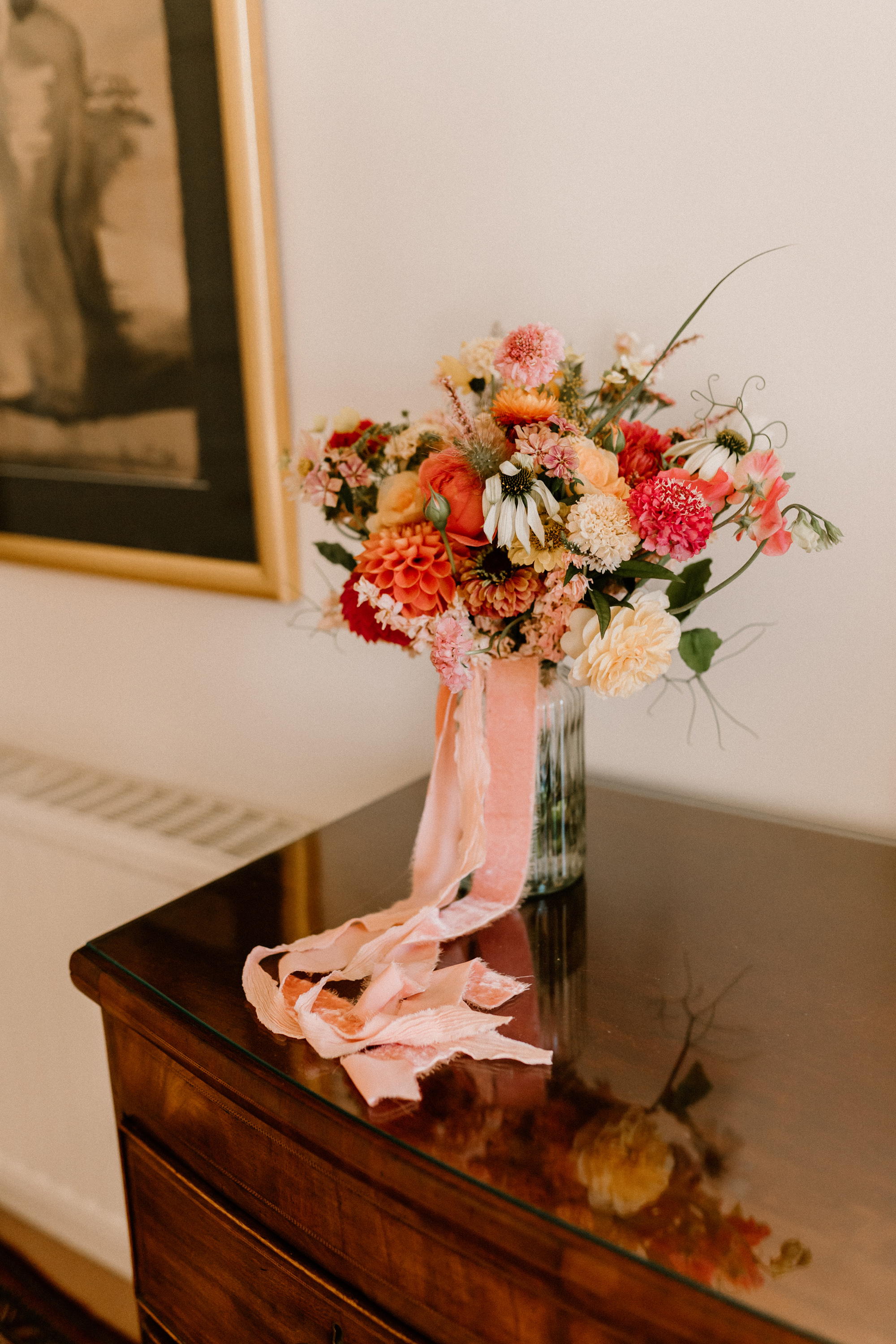 Hannah in Jesus Peiro for her Intimate Brunton House Wedding in Northumberland 17 Colourful late Summer early Autumn wedding bouquet with peach silk ribbons and dahlia.
