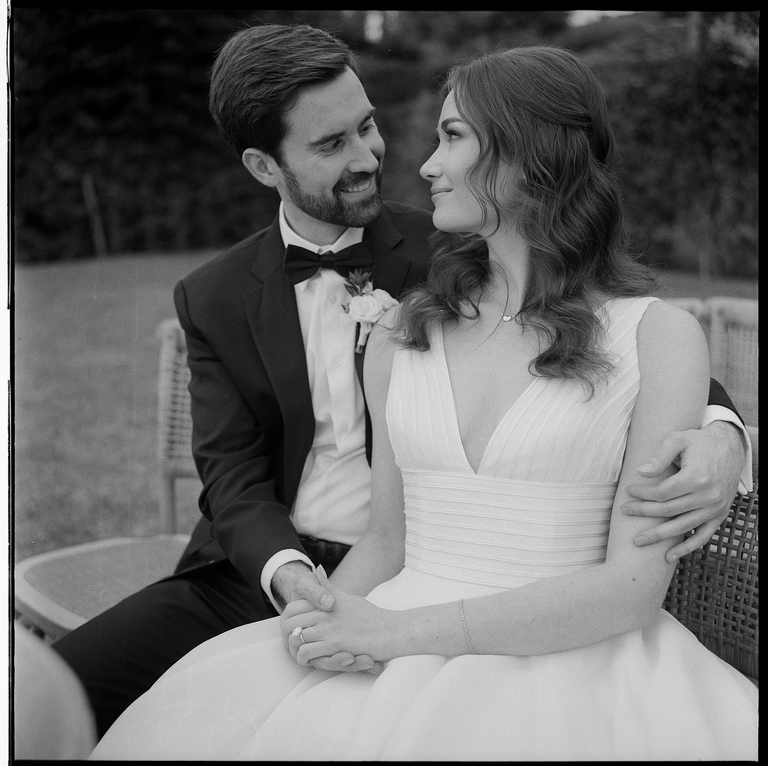 An Elegant Destination Wedding in Cortona, Italy, with a Peter Langner Gown 35 35mm film format wedding photography of bride and groom embracing.