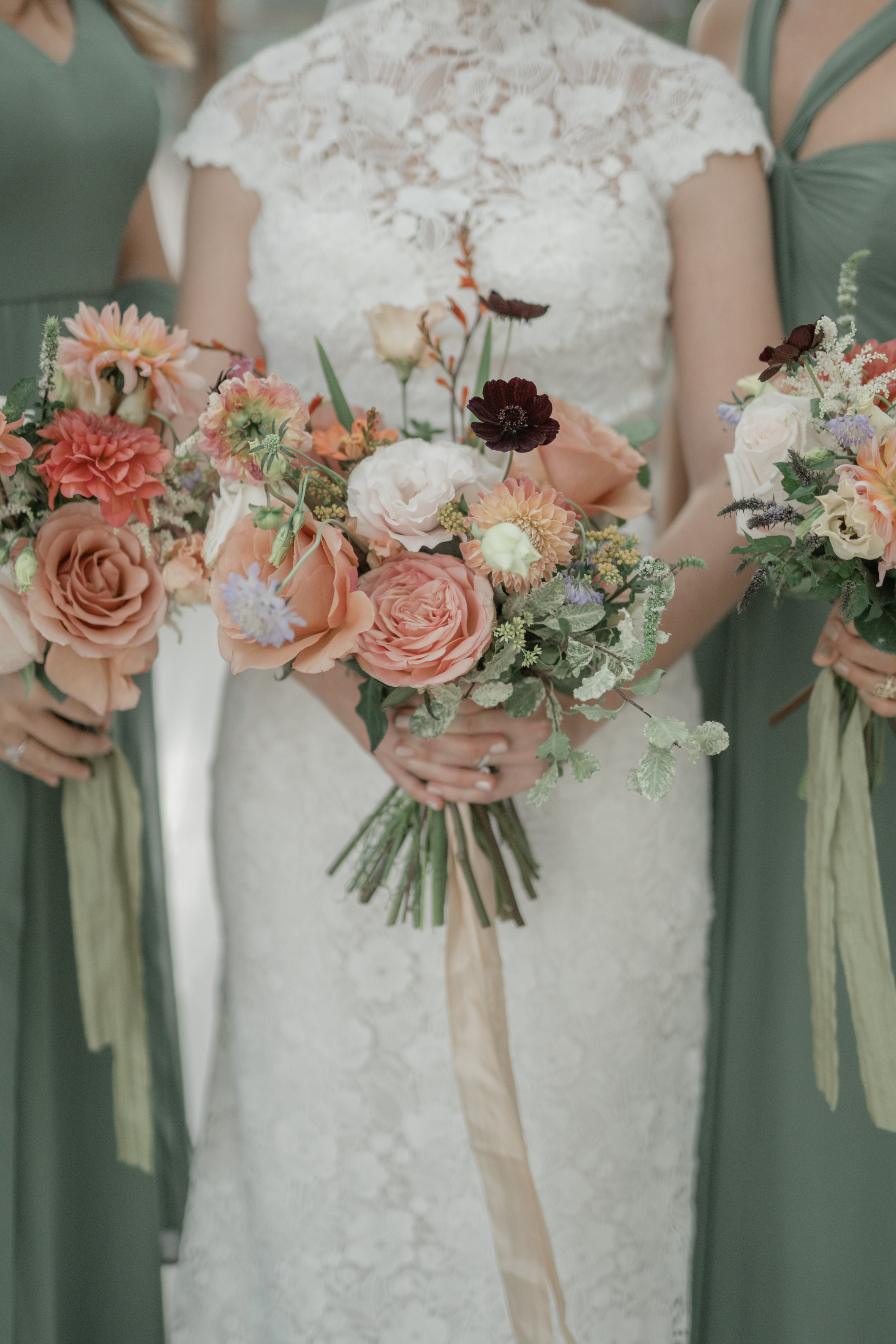 A Dreamy Kew Gardens Glasshouse Wedding Planned by Rachel Dalton 24 Elegant Autumn / September wedding bouquet with Chocolate Cosmos, peach roses and Scabia. The bride wears Mark Ingram wedding dress and her bridesmaids are in sage green.