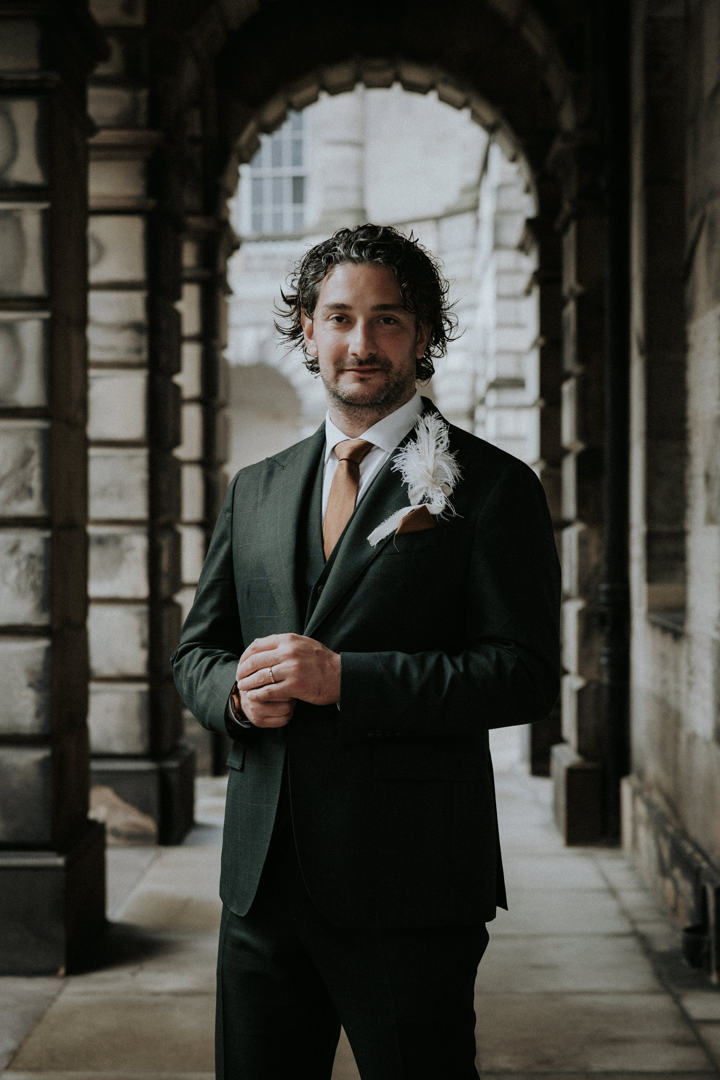 Elegant modern groom standing on the streets of Edinburgh.  Bernadeta Kupiec Photography.