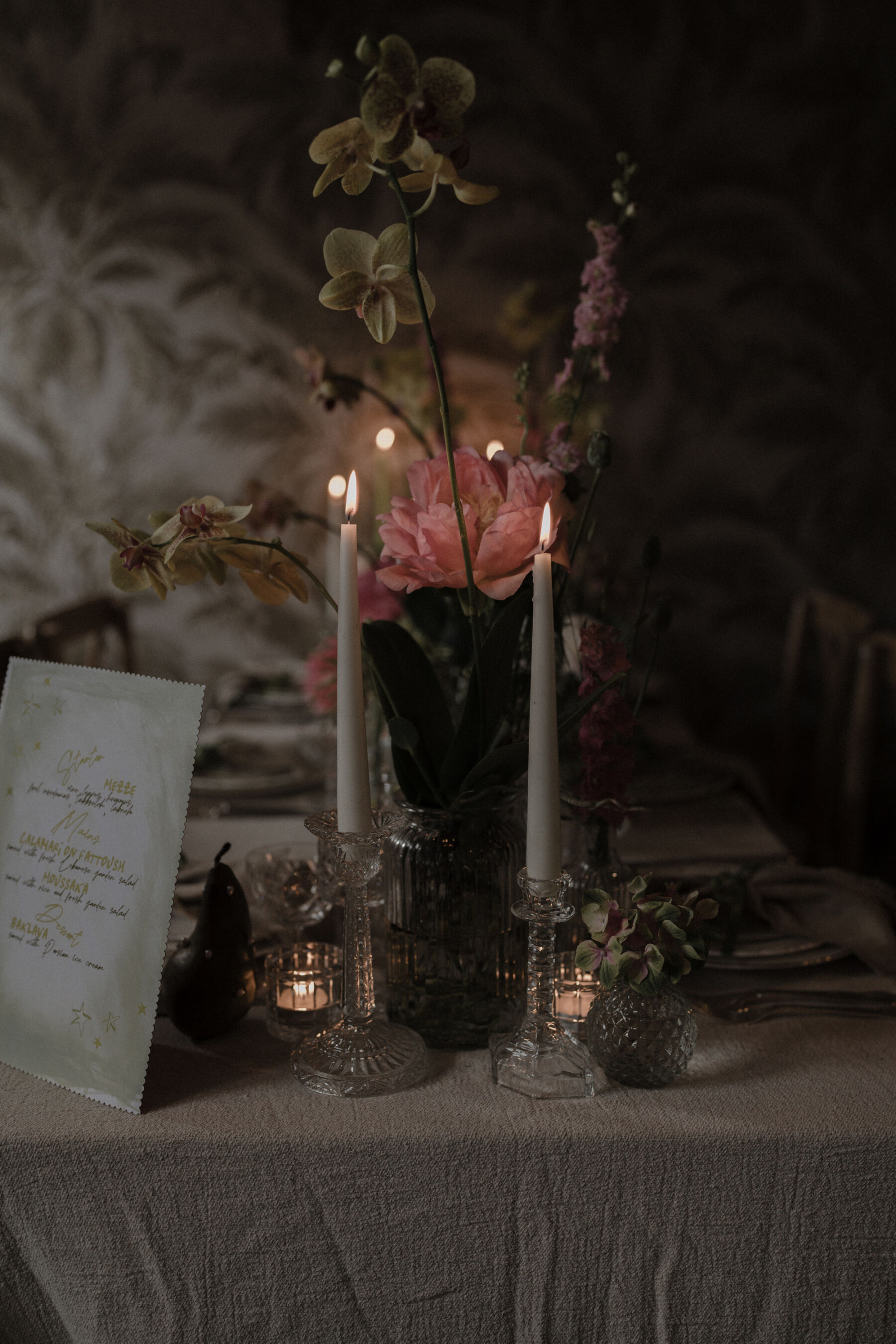 Dark and romantic wedding editorial images featuring candle lit scenes and peonies. Floral styling by Luvshifting Flowers.