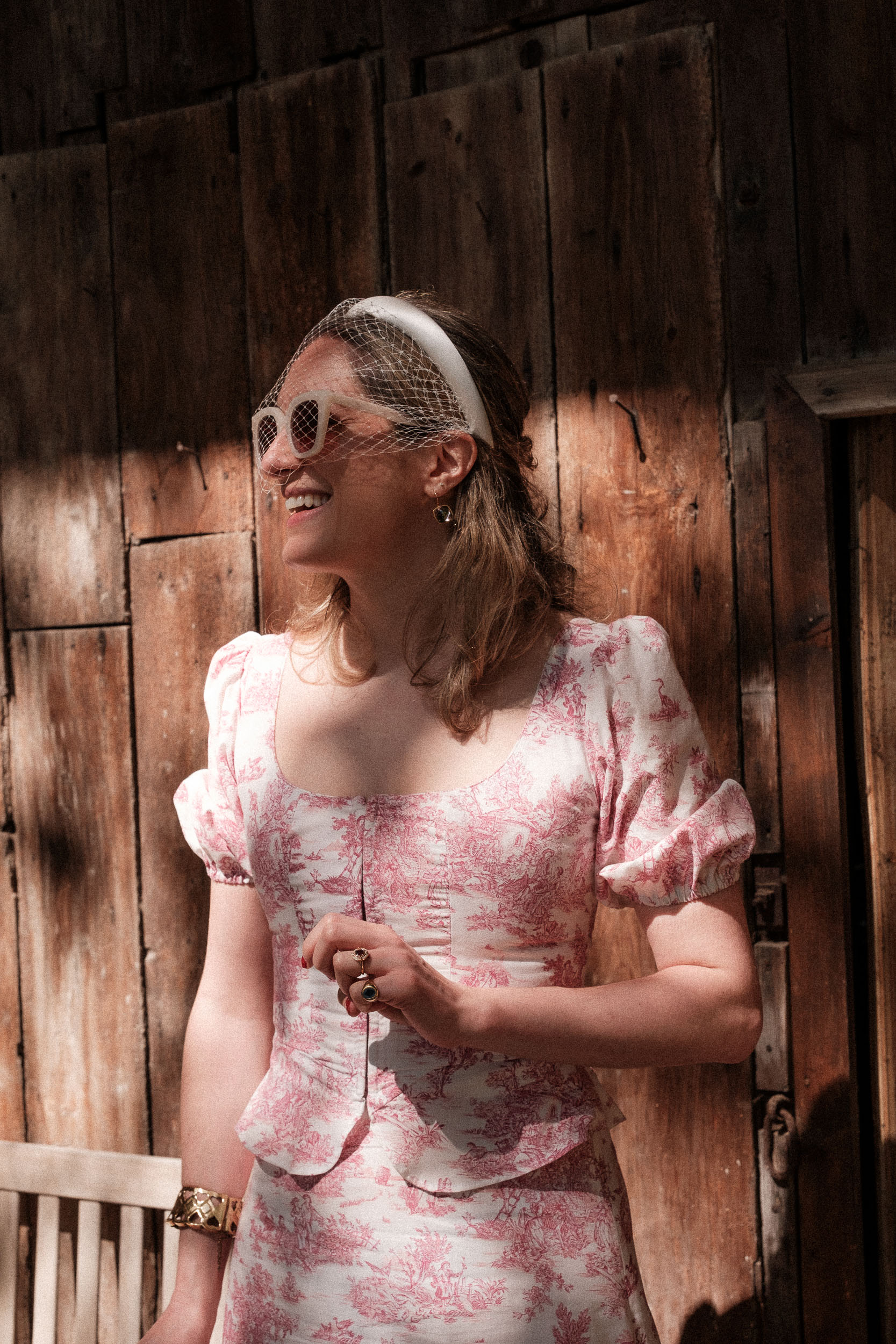 Non-Traditional Two-Piece Wedding Look by Annina Dirndl. Bride also wears sunglasses and a Jennifer Behr birdcage veil headband.